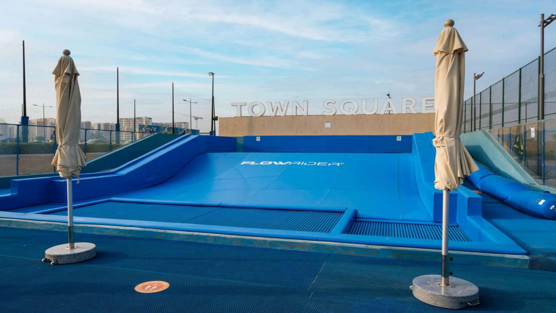 Brand new 3-bedroom townhouse exterior in Zahra, Town Square, showing backyard space