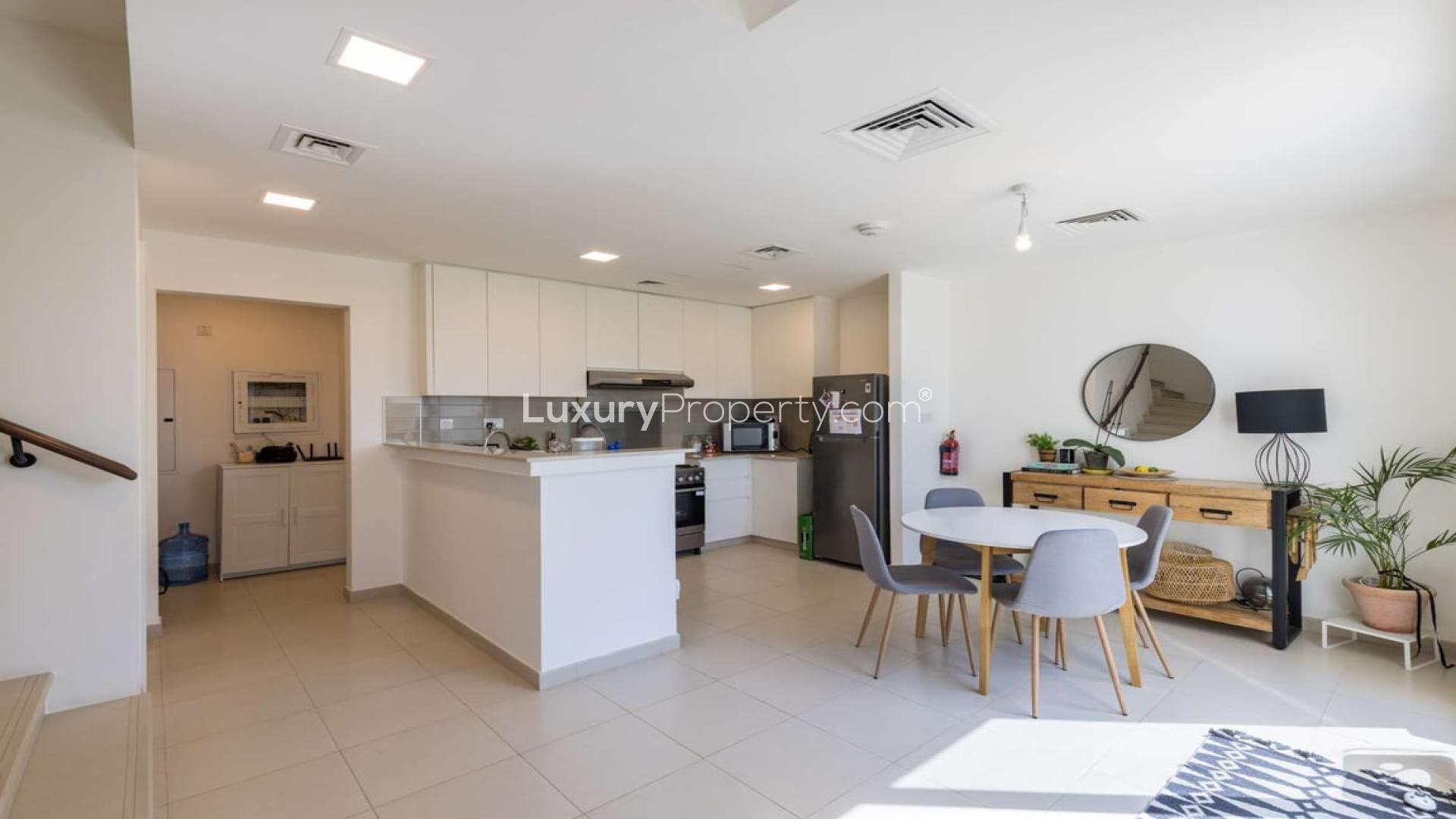 Exterior view of modern 3-bedroom townhouse in Noor, Town Square for sale