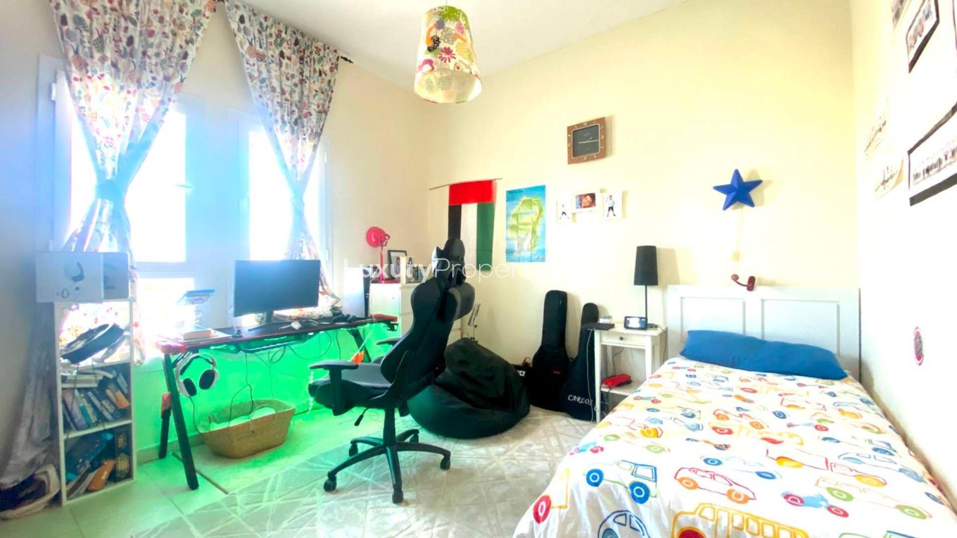 Townhouse bedroom with study desk and single bed in Arabian Ranches, Alma community