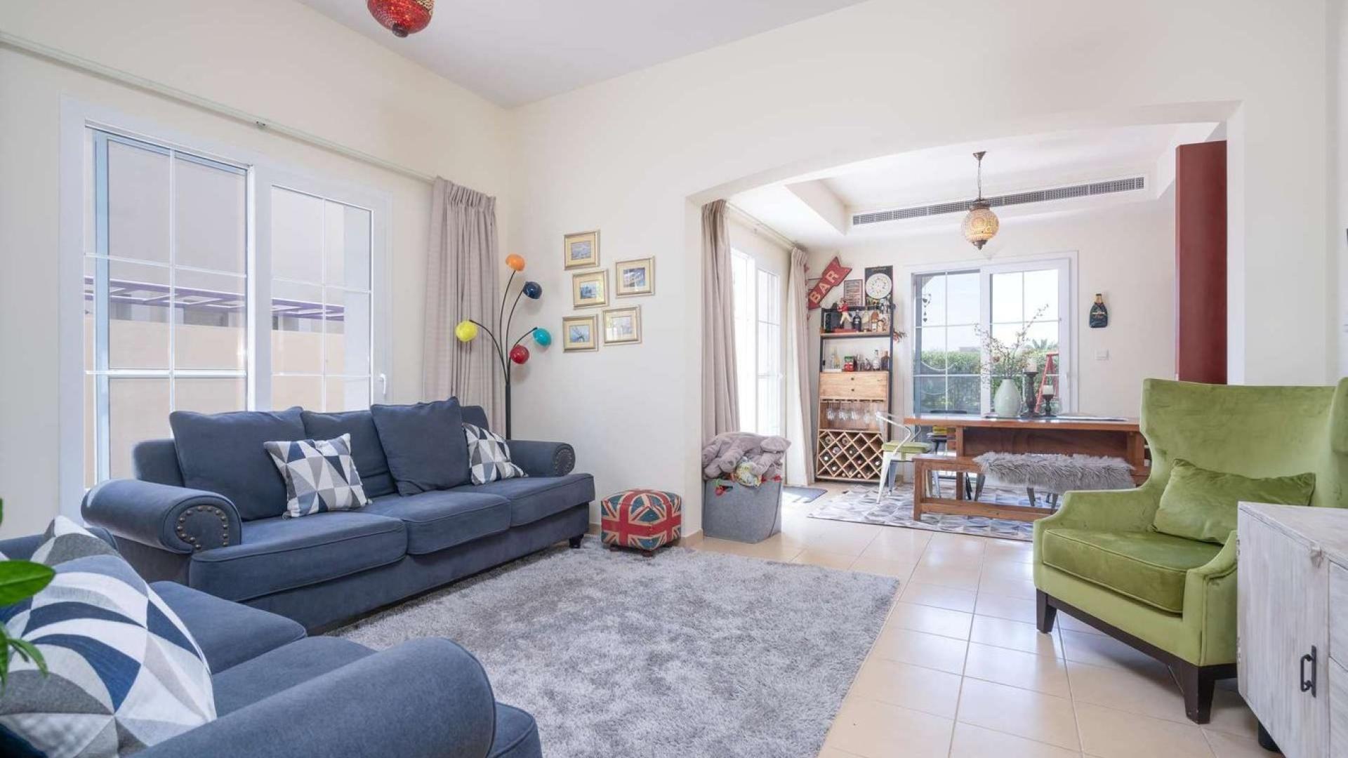 "Bright living room in 3-bedroom villa for sale, Alma, Arabian Ranches, Ref No: LP09989.",Spacious living room in 3-bedroom villa, Alma, Arabian Ranches, featuring modern decor and furniture