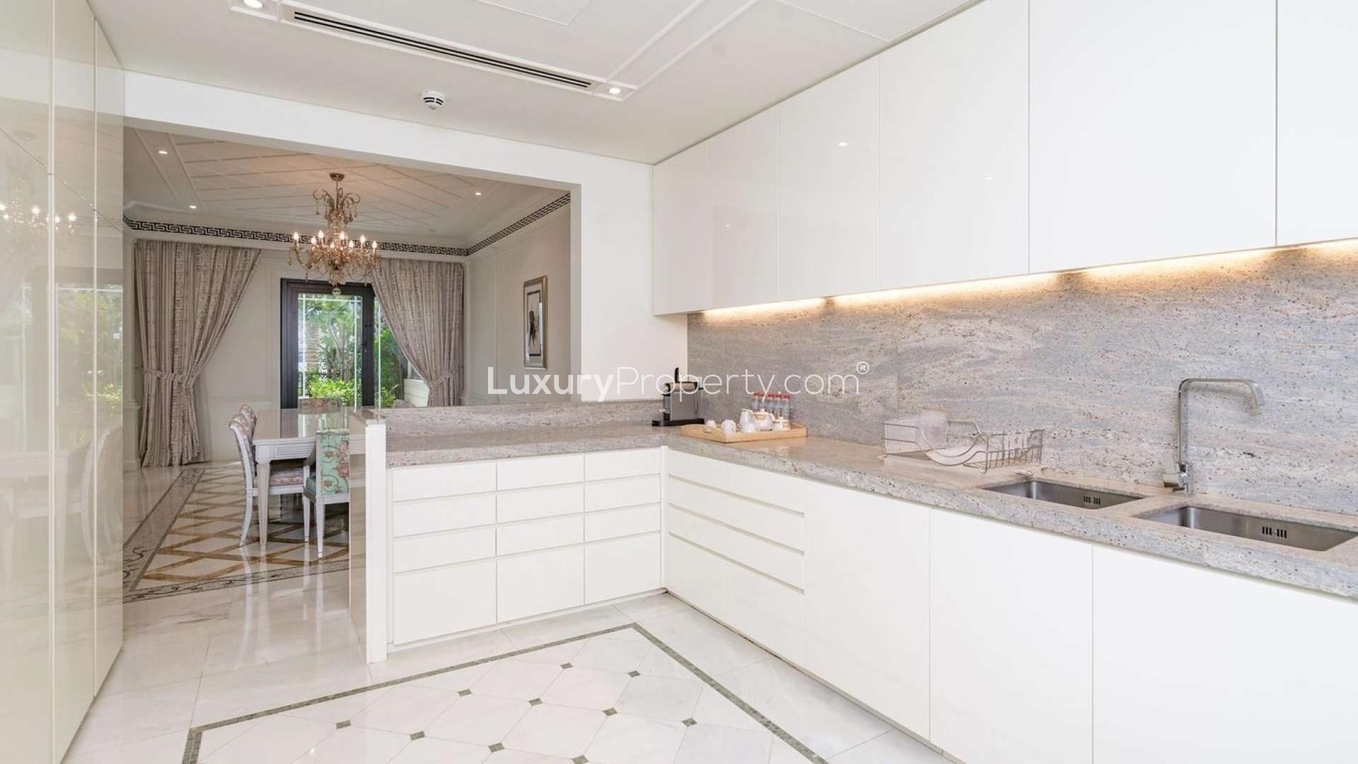 Luxurious living room in Palazzo Versace townhouse, Culture Village, with elegant decor and pool view