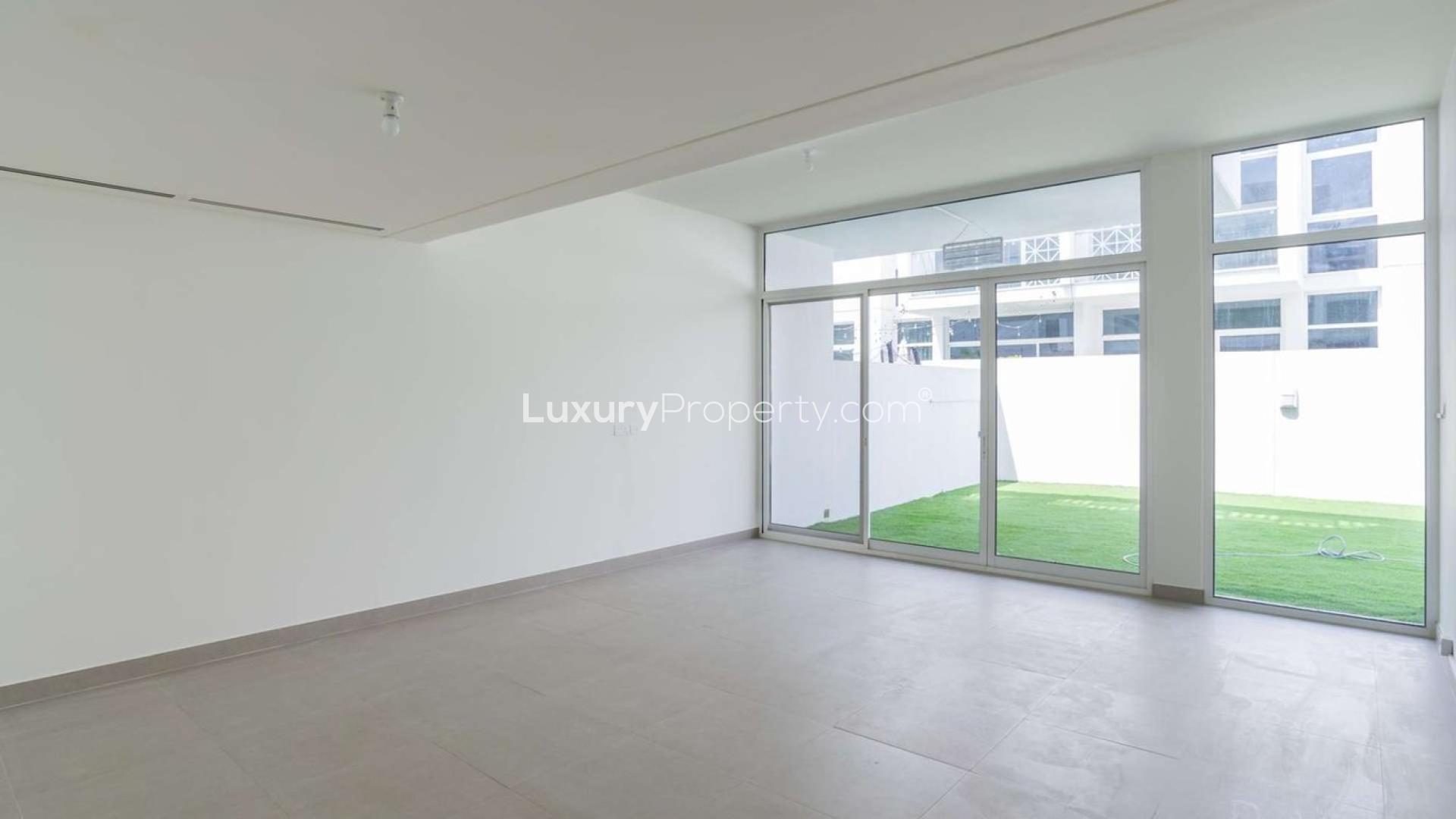 Spacious living area with large windows, modern townhouse in Arabella, Mudon for sale