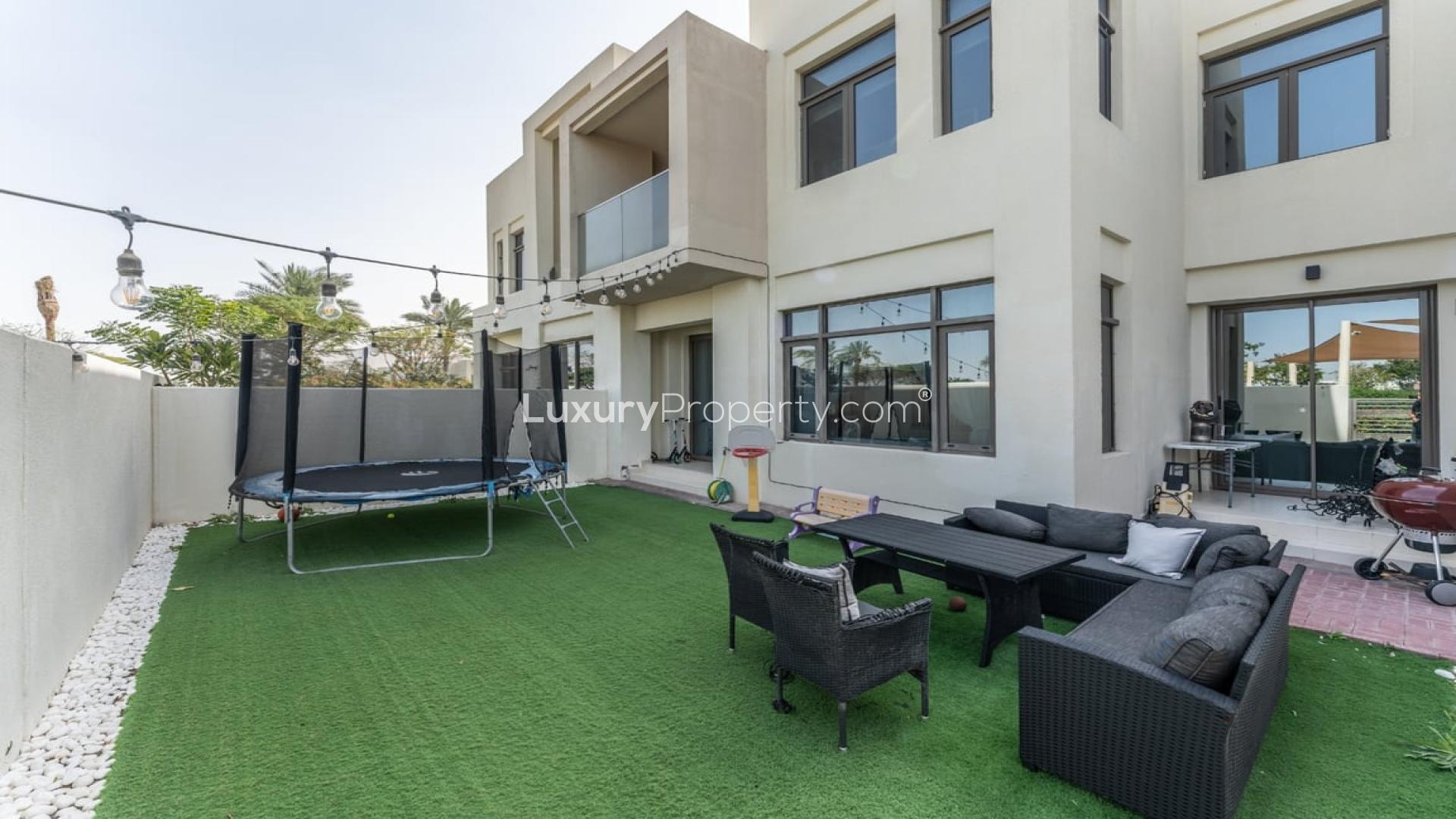 Elegant living room in 3-bedroom villa, Mira Oasis 1, Reem, with modern decor and garden view