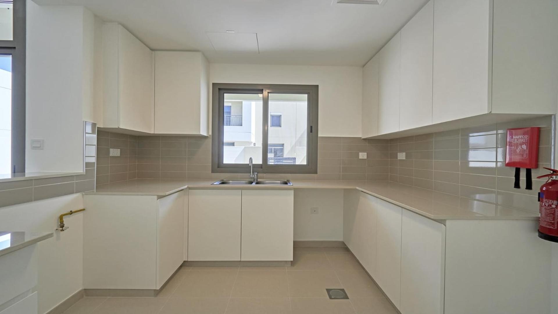 Spacious interior of a modern townhouse for sale in Naseem Town Square, open layout