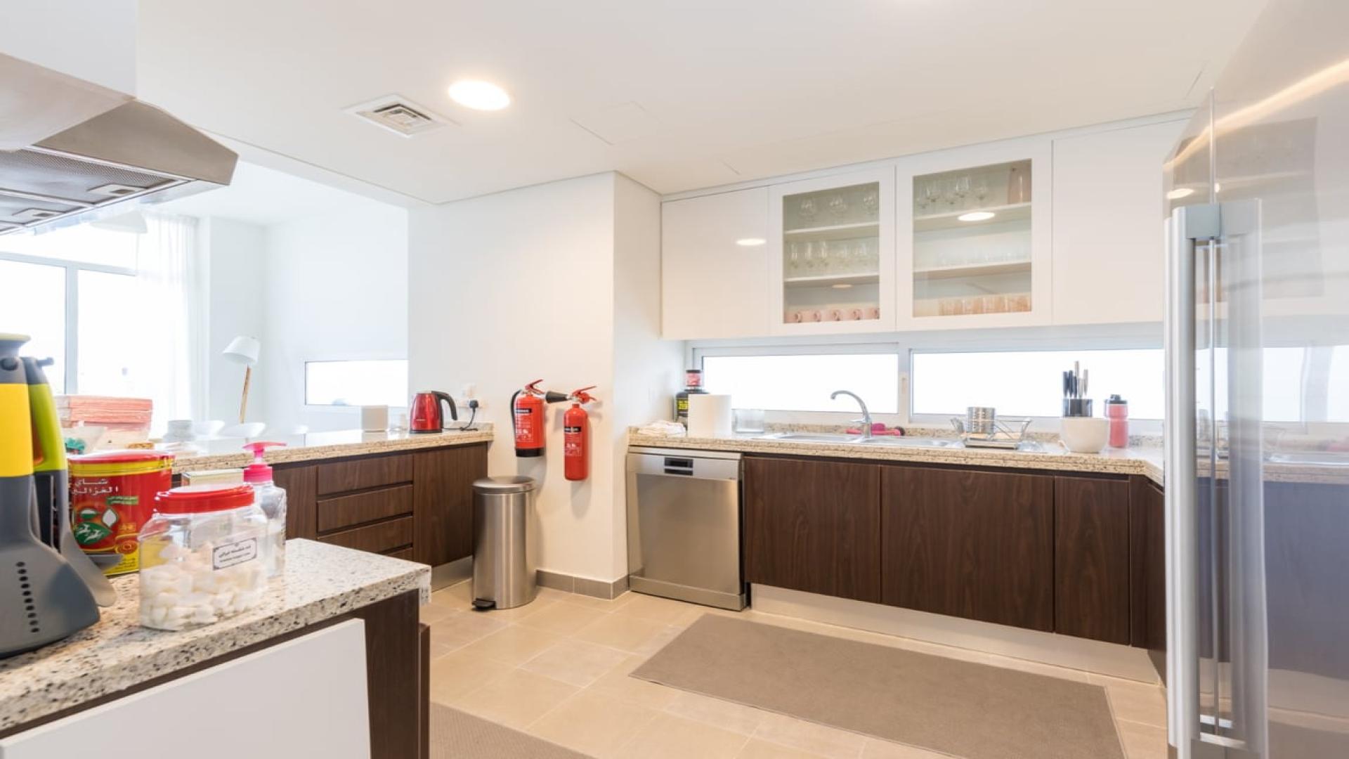 Contemporary living room in Mudon's Arabella Townhouses, featuring modern furniture and open layout
