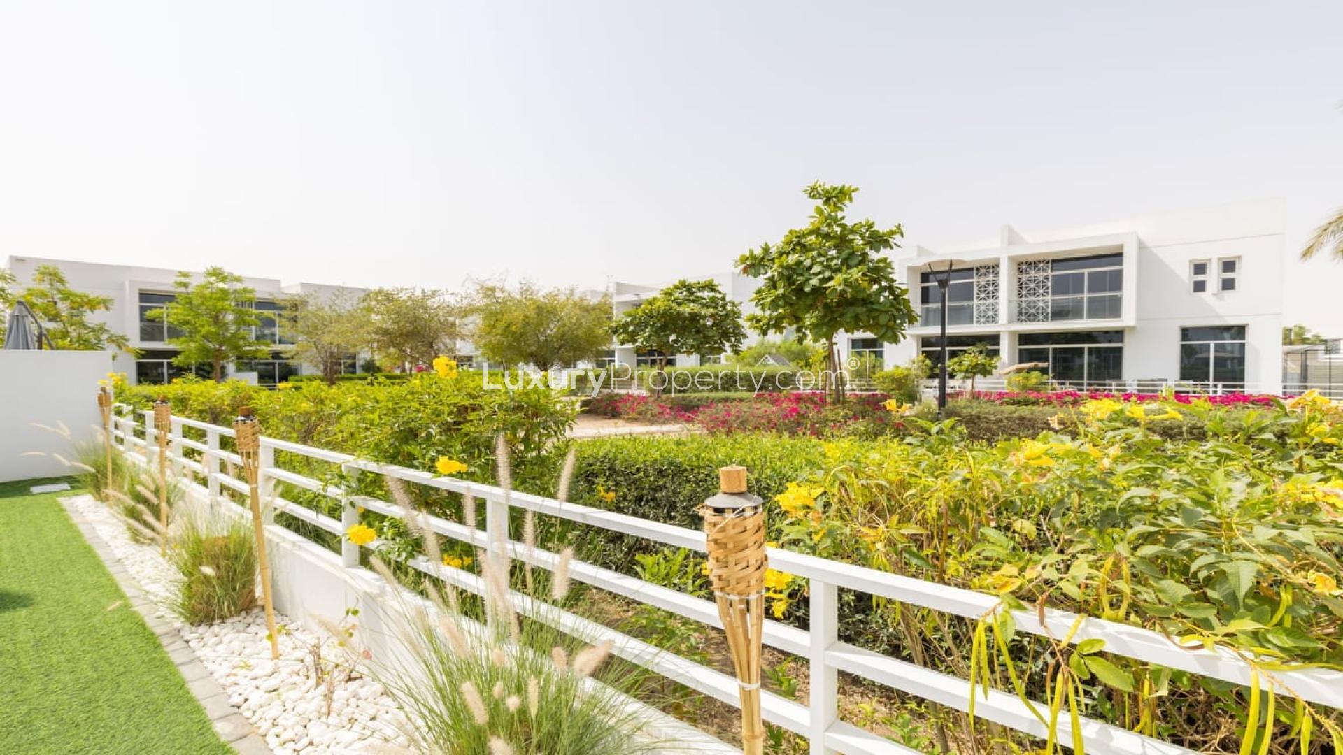 Contemporary living room in Arabella Townhouse, Mudon with modern furniture and large windows
