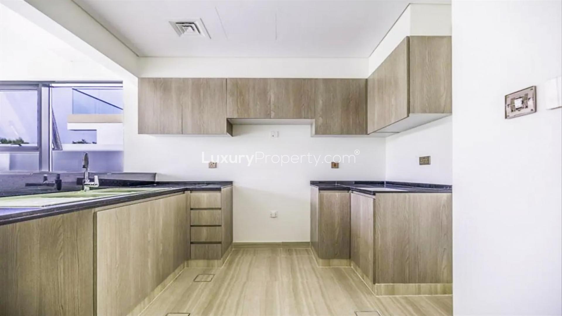 Brand new Damac Hills townhouse interior with modern kitchen and staircase, Park Residences