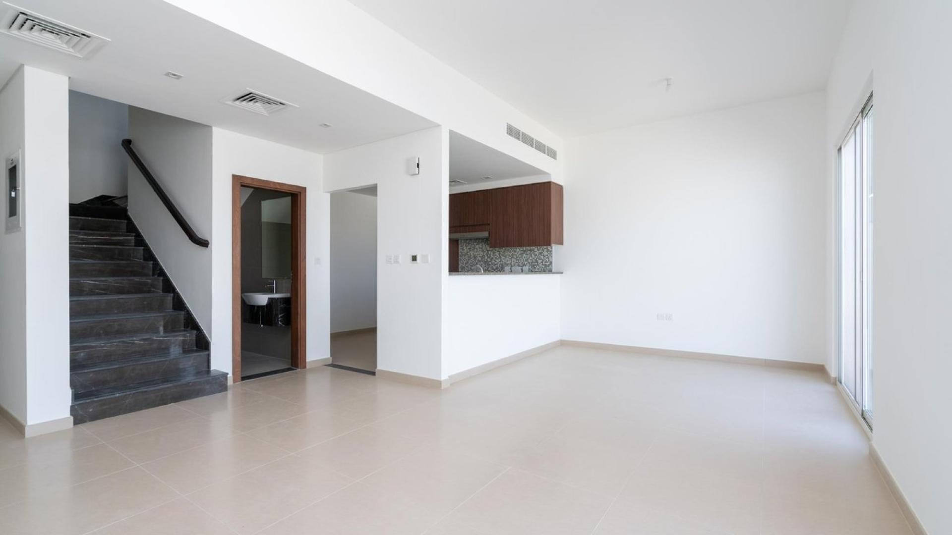 Modern 3-bed townhouse exterior in Arabella 3, Mudon, featuring covered parking space