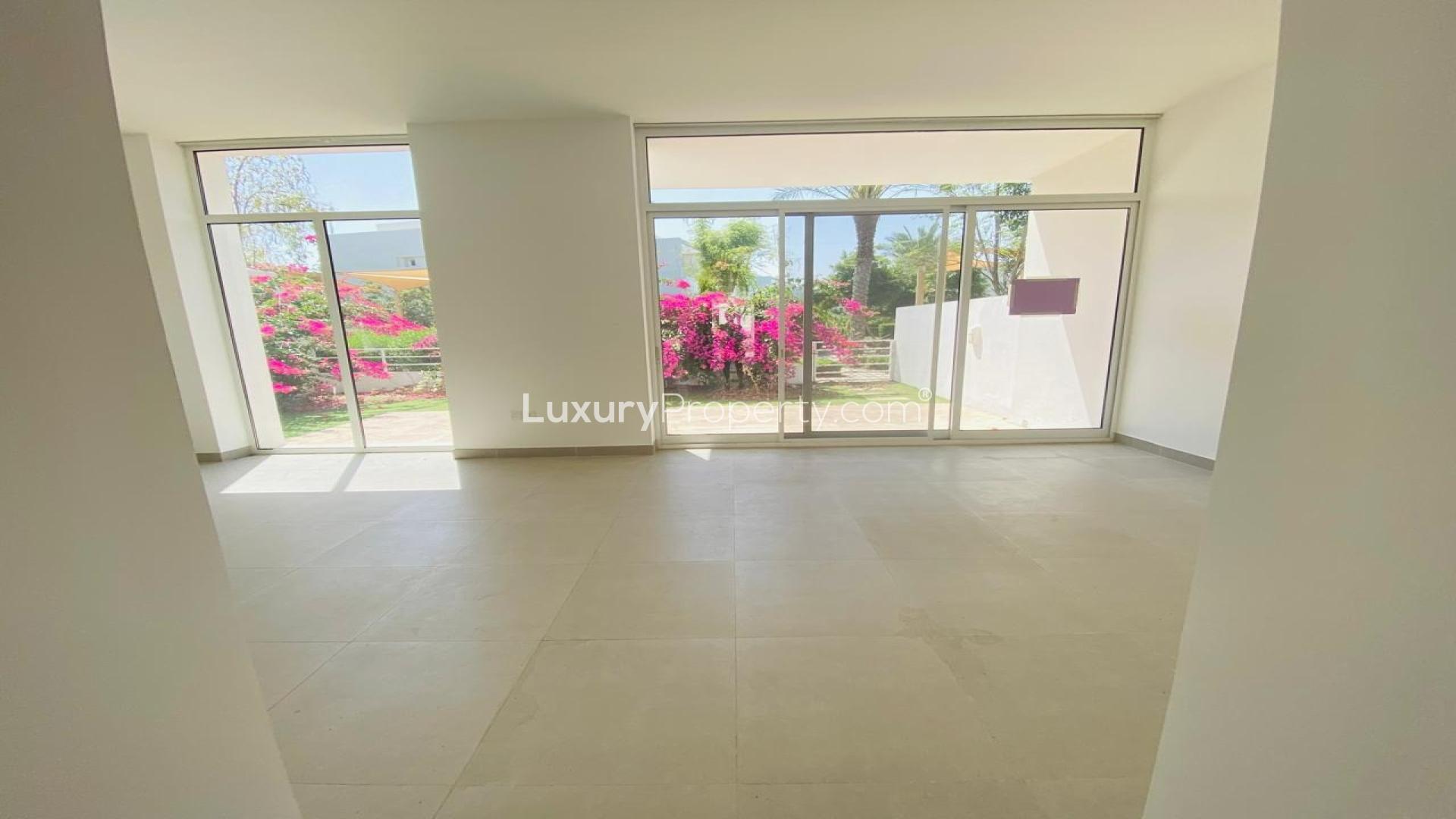Spacious living area with large windows in Mudon Arabella Townhouse for sale