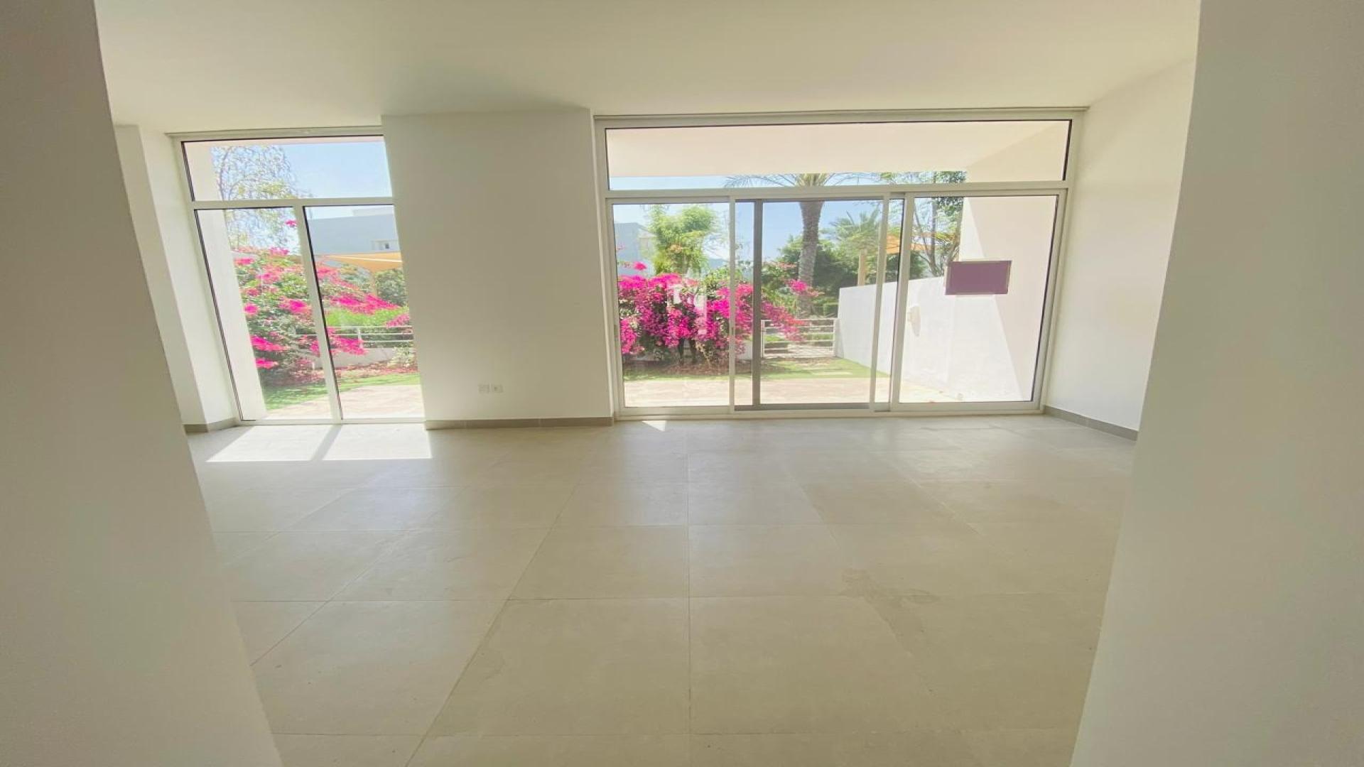 Spacious living area with large windows in Mudon Arabella Townhouse for sale