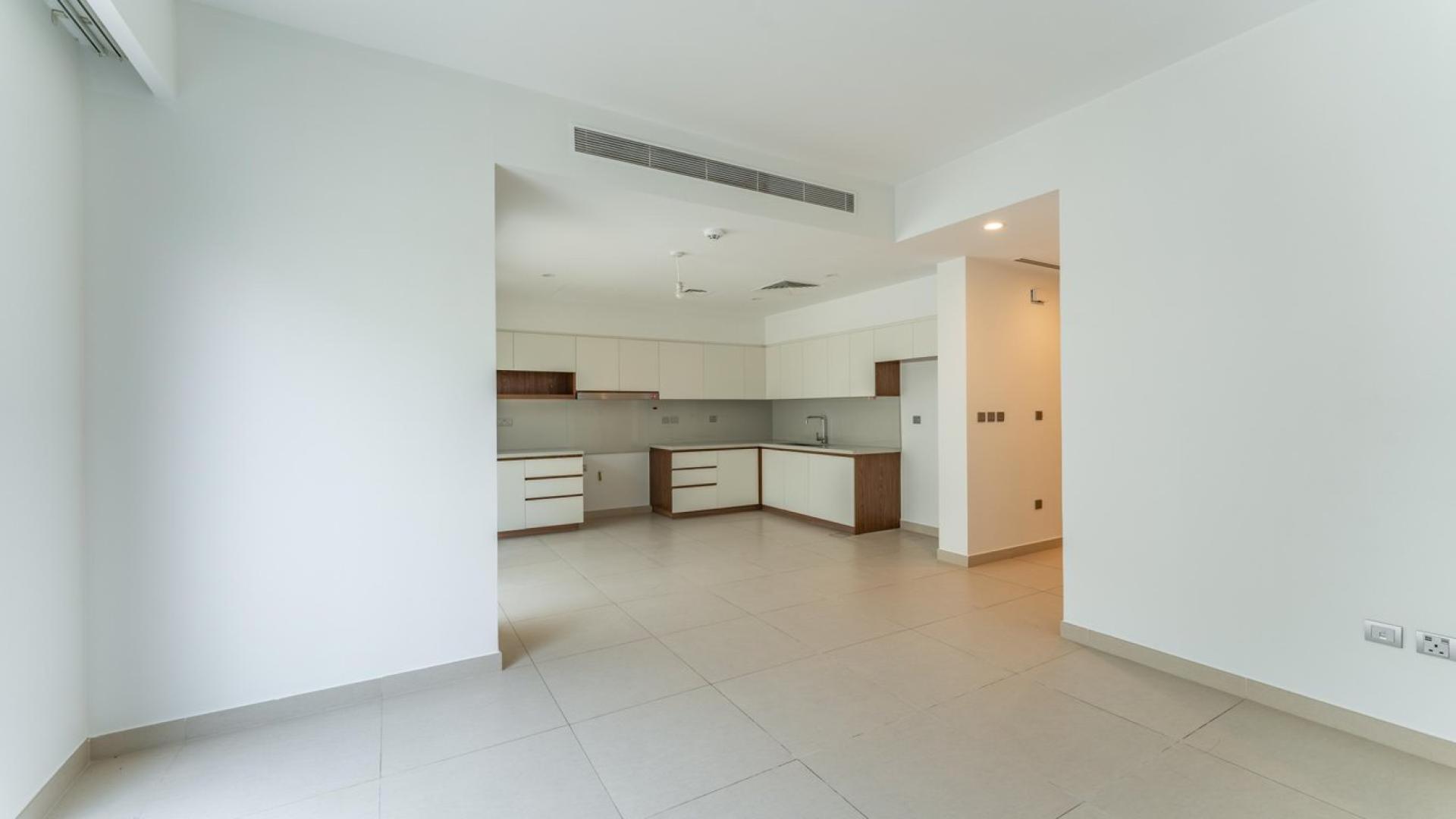 Open-plan kitchen and living area in luxurious Camelia townhouse, Arabian Ranches 2