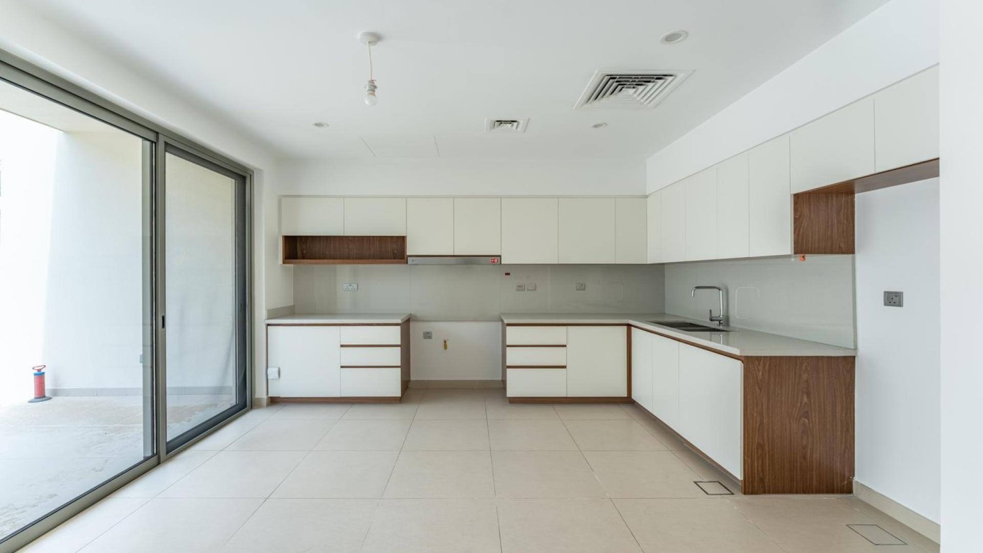 Luxurious 3-bedroom townhouse exterior in Camelia, Arabian Ranches 2, with covered parking