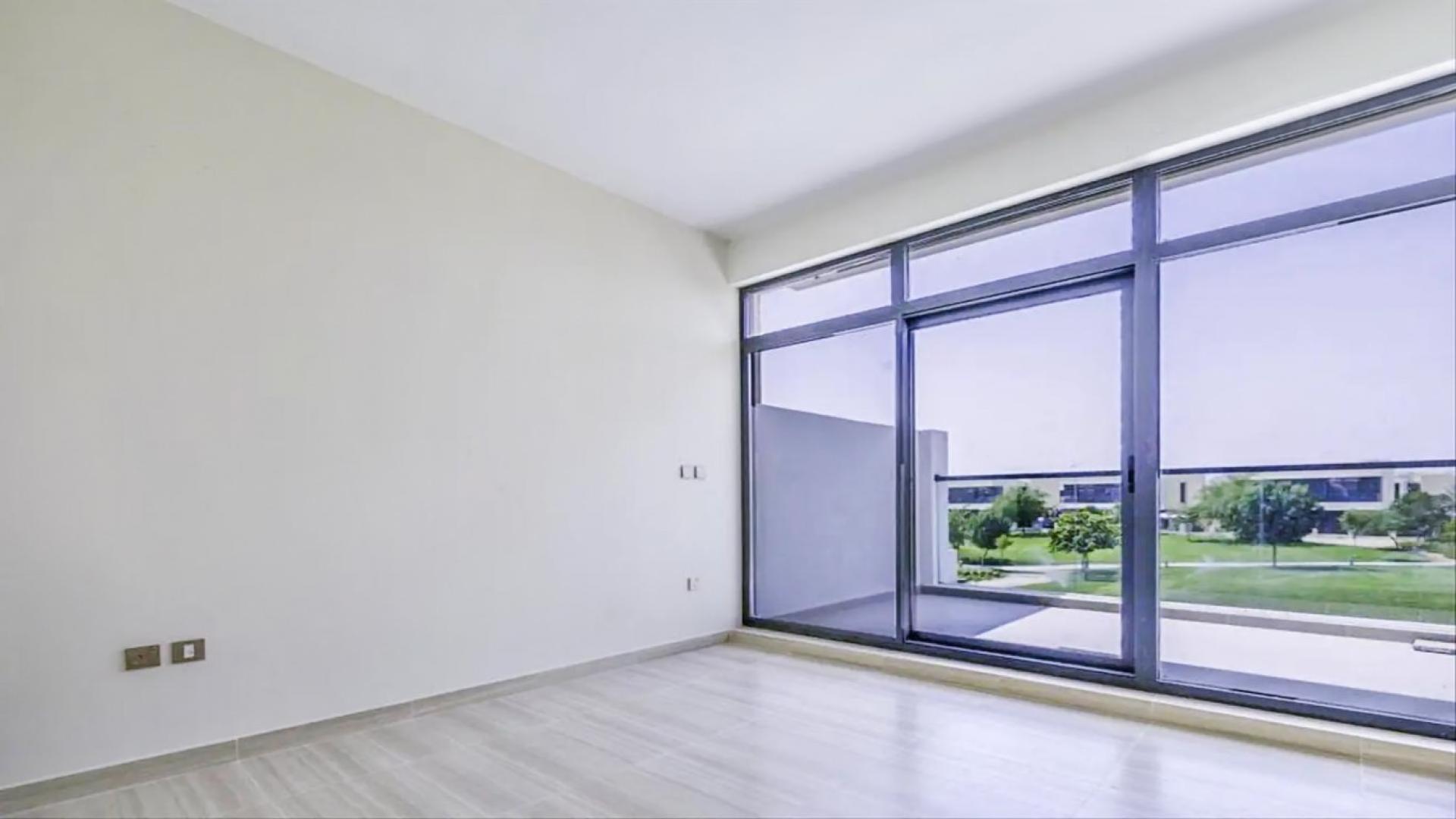 Modern kitchen in 3-bedroom townhouse, Park Residences, Damac Hills, with sleek cabinetry and countertops