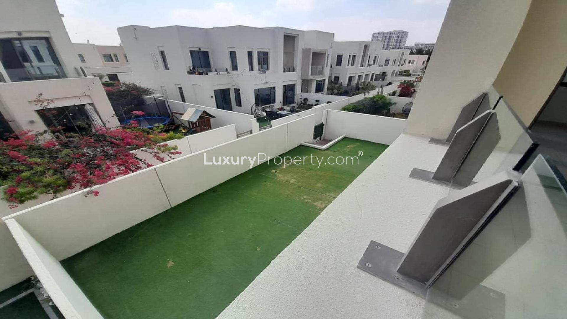 Spacious living area in Mira Oasis townhouse, featuring modern design and natural light