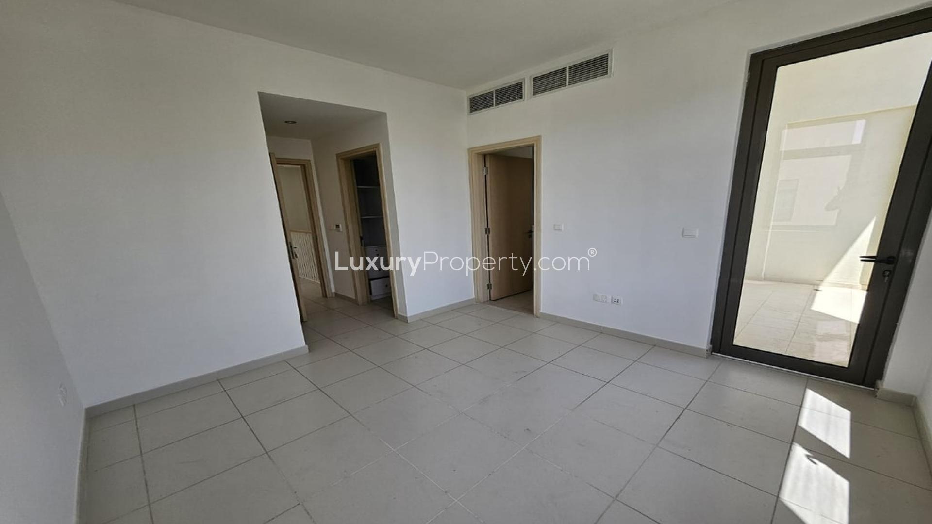 Spacious living area in Mira Oasis townhouse, featuring modern design and natural light