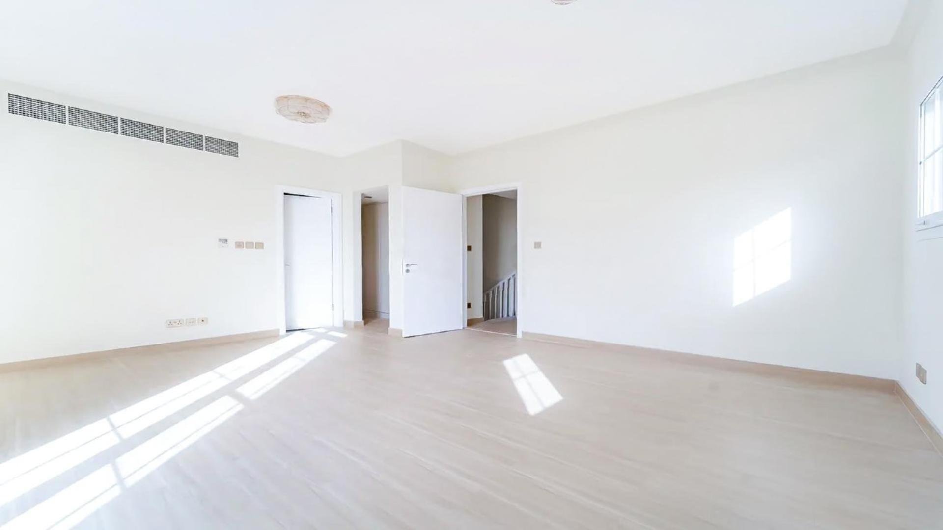 Empty bedroom with built-in wardrobes in Arabian Ranches 2 townhouse, Al Reem community