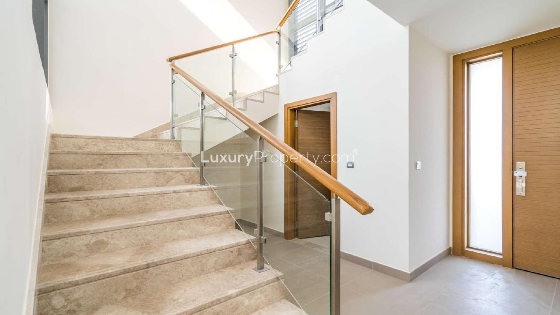 Modern staircase with glass railing in Sidra Villa, Dubai Hills Estate