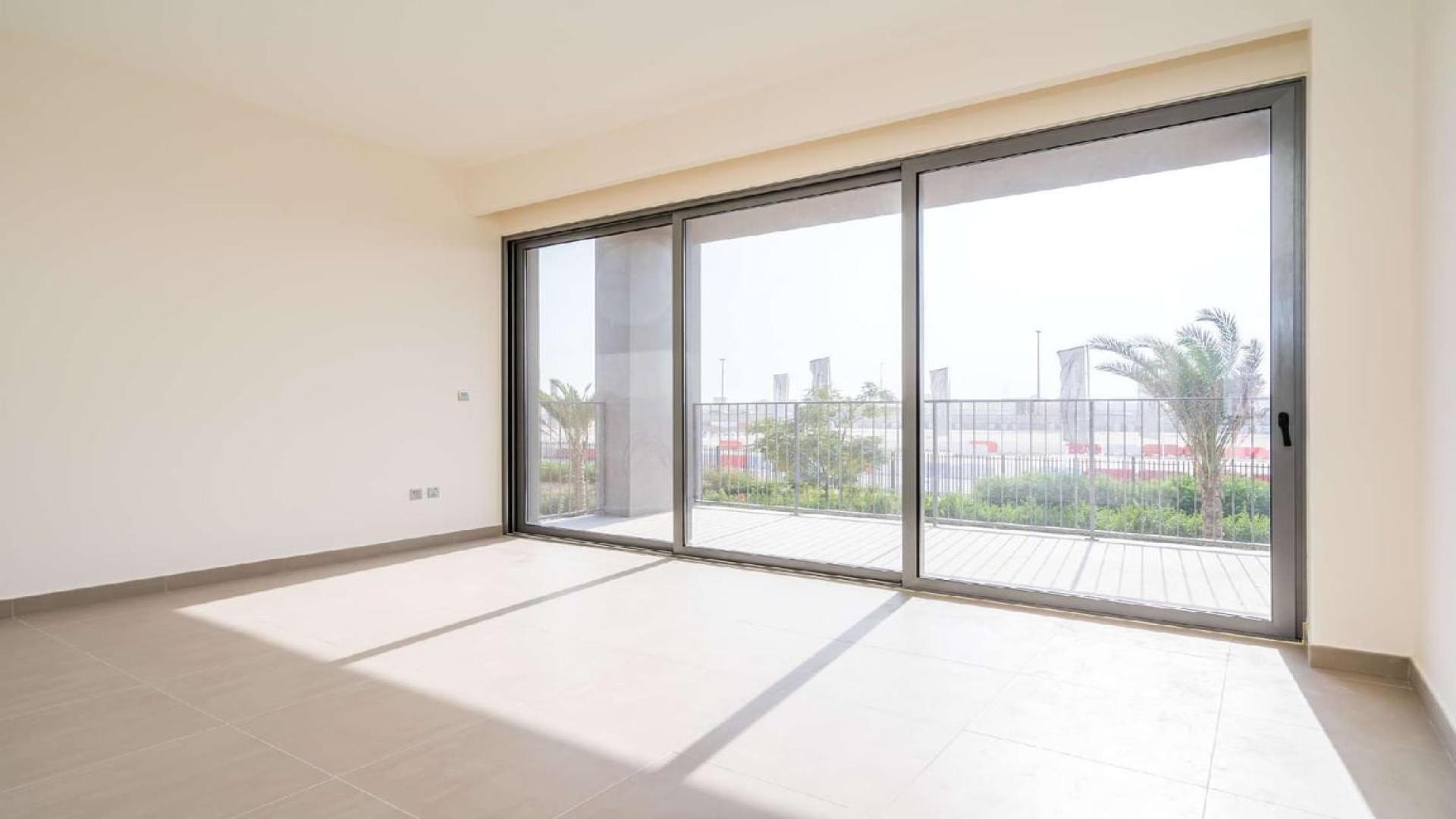 Bright living room with floor-to-ceiling windows in Sidra, Dubai Hills Estate villa
