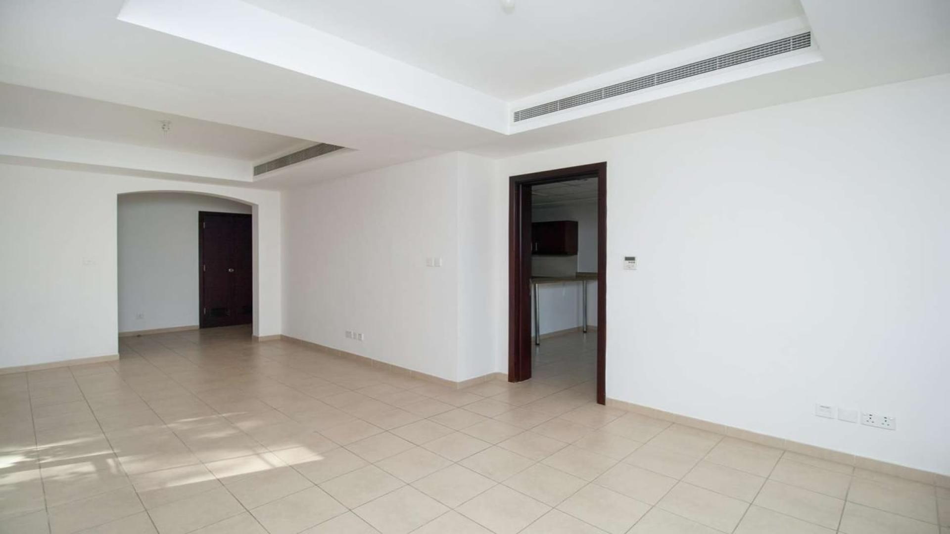 Empty living room in 3-bedroom villa, Arabian Ranches, Al Reem, tiled floors, bright interior