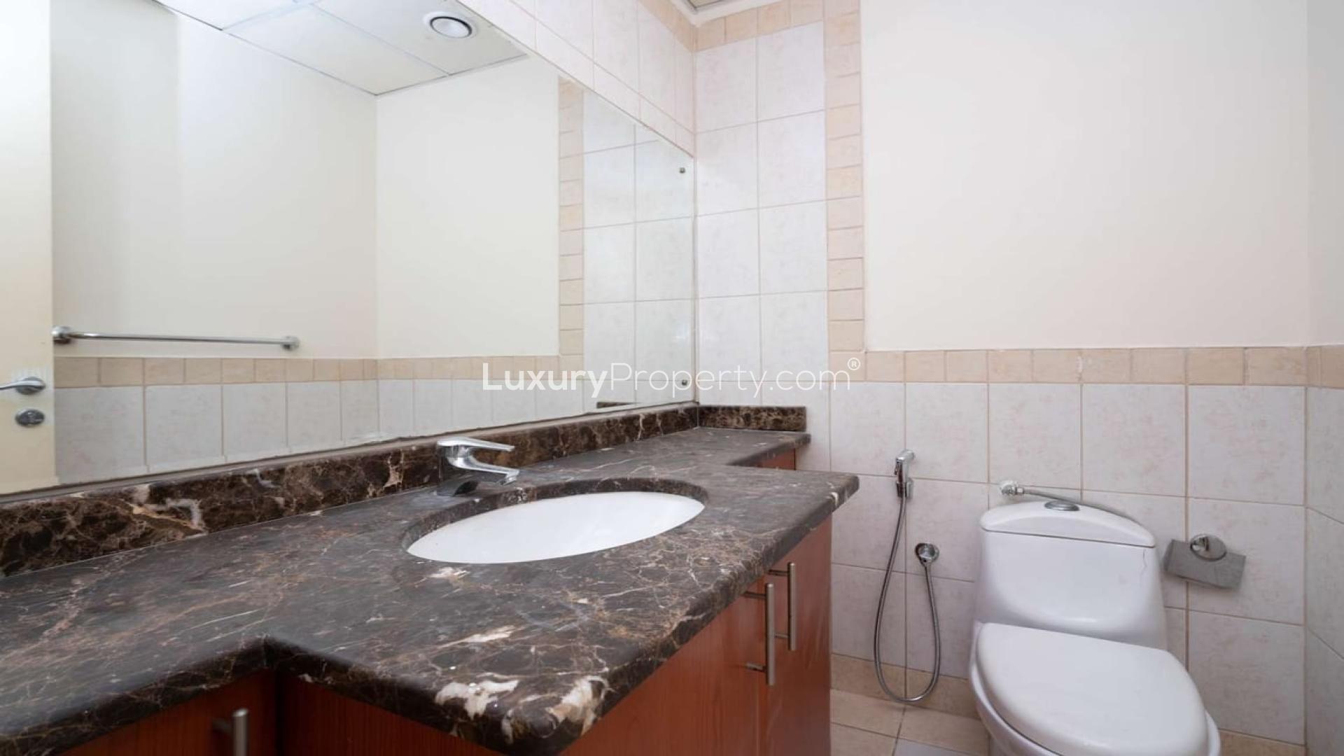 Spacious living room with large windows in Springs 11 townhouse for rent