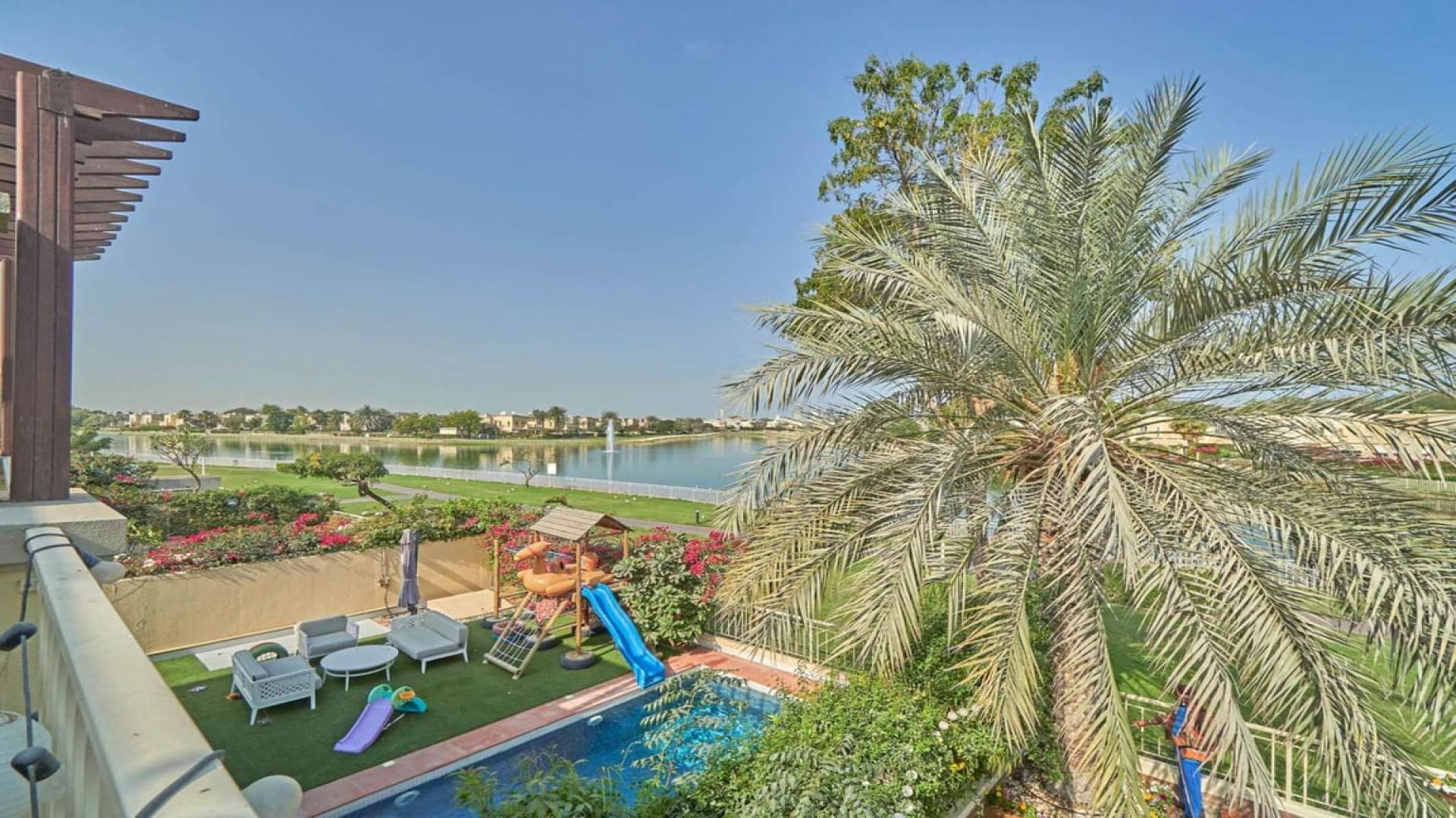 Upgraded villa with private garden, pool, and lake view in The Springs community