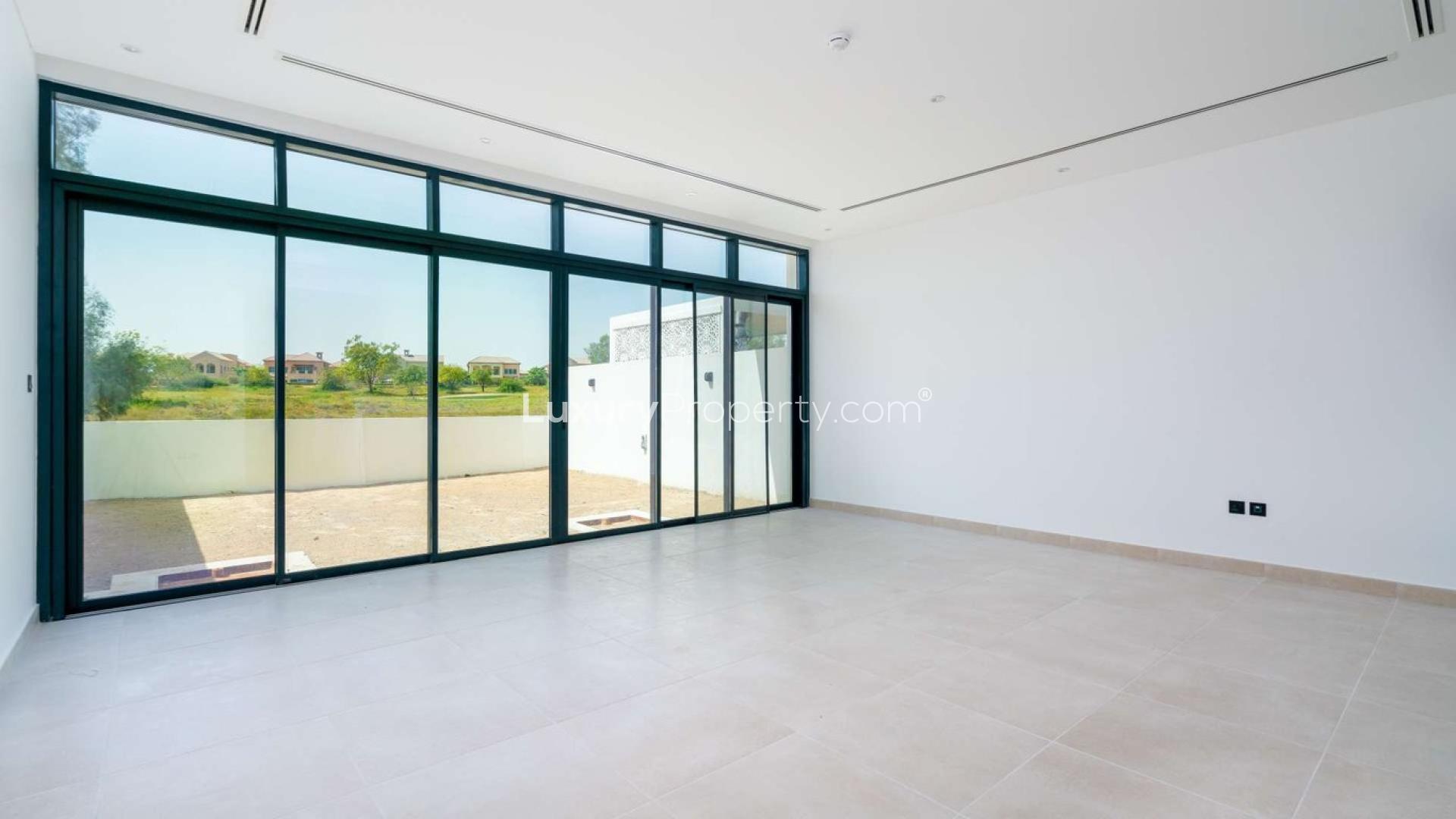 Luxurious villas overlooking green golf course in Jumeirah Luxury Living, Jumeirah Golf Estates