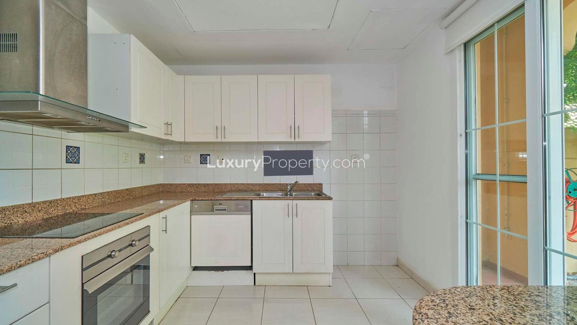 "Spacious backyard with lush garden at The Springs villa for rent, Ref No: LP06735.",Modern kitchen in 3-bedroom villa for rent, The Springs, opposite park and pool