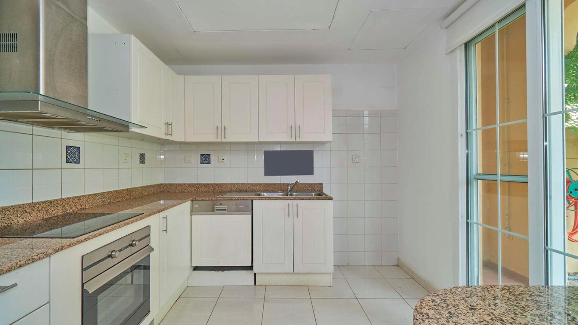 "Spacious backyard with lush garden at The Springs villa for rent, Ref No: LP06735.",Modern kitchen in 3-bedroom villa for rent, The Springs, opposite park and pool