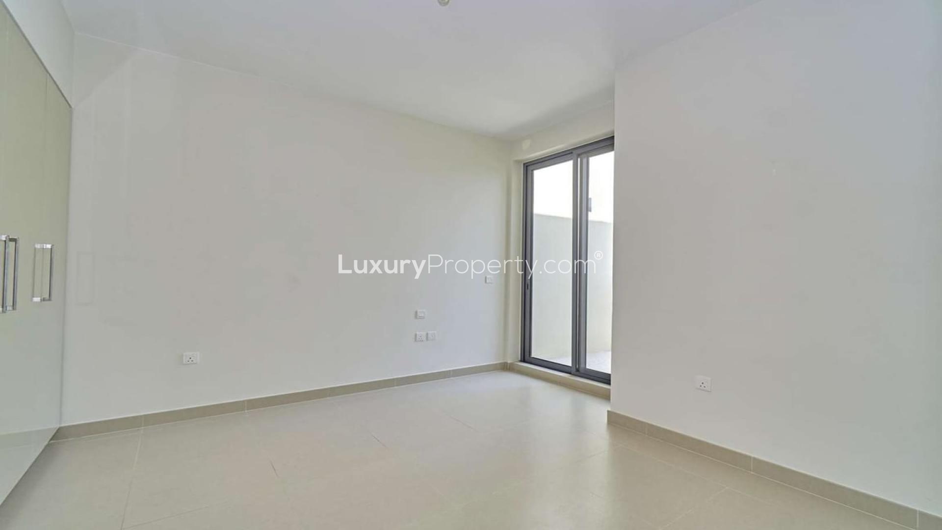 Three-bedroom townhouse exterior with garden in Maple 1, Dubai Hills Estate for rent