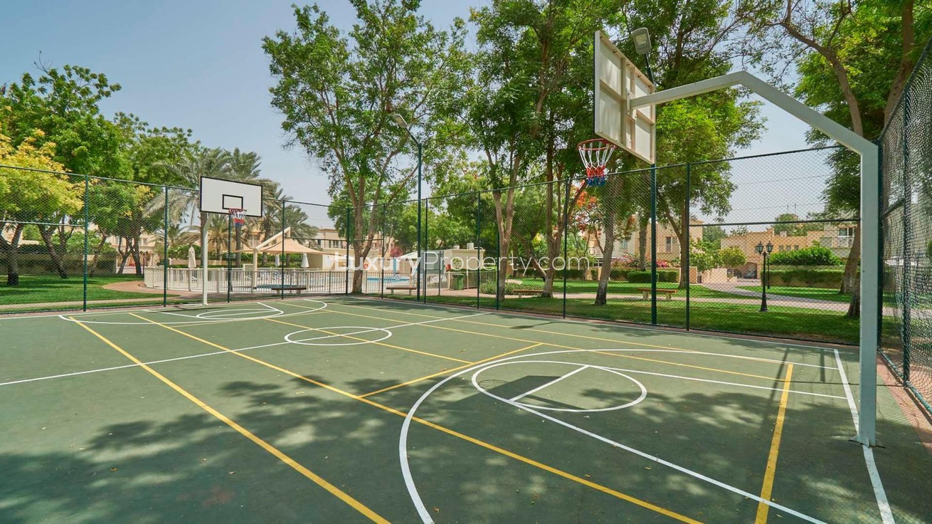 Outdoor patio with modern furniture and garden view in Springs 7 villa for rent