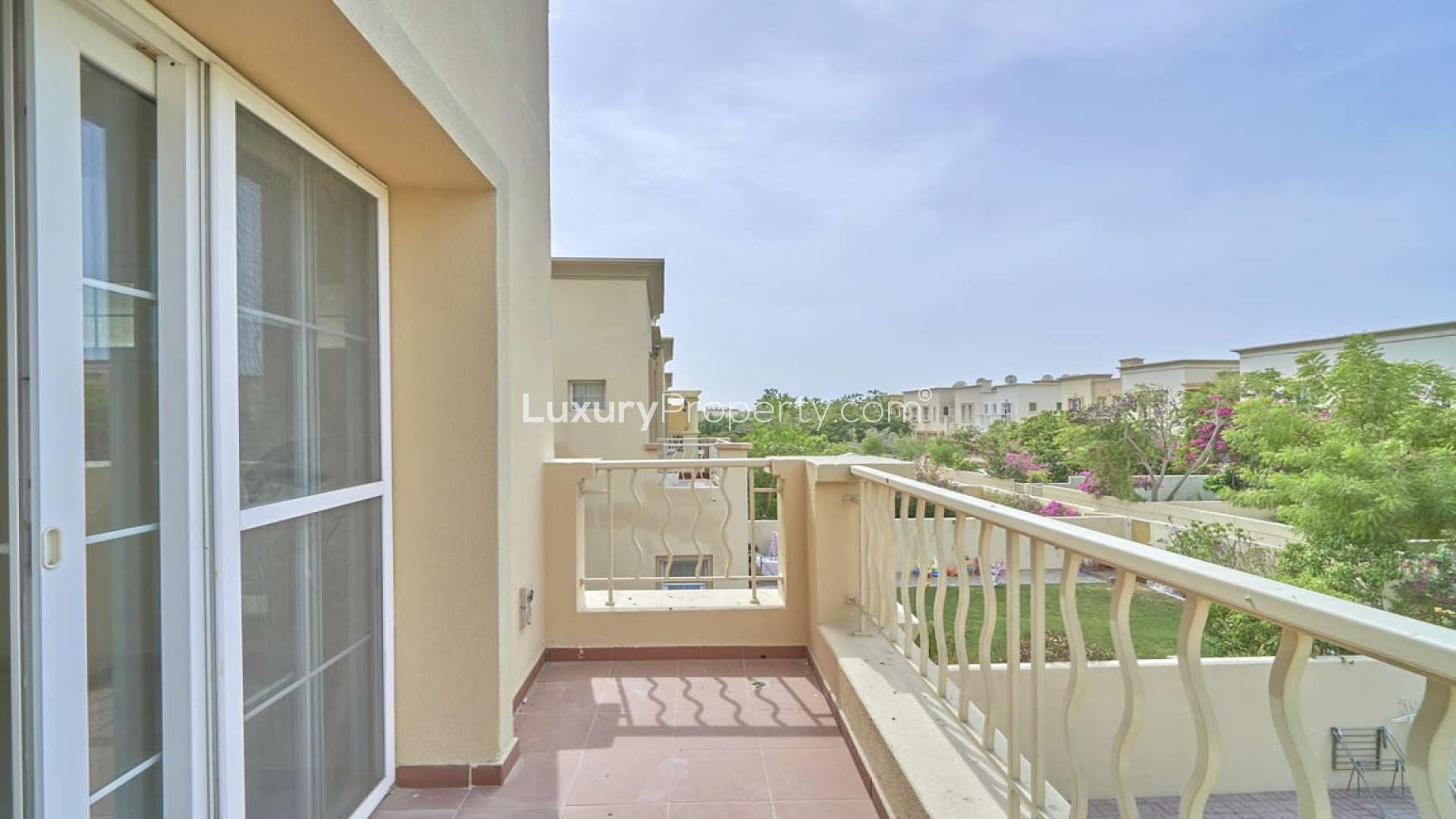 Balcony view from Springs 11 townhouse overlooking landscaped garden, available for rent