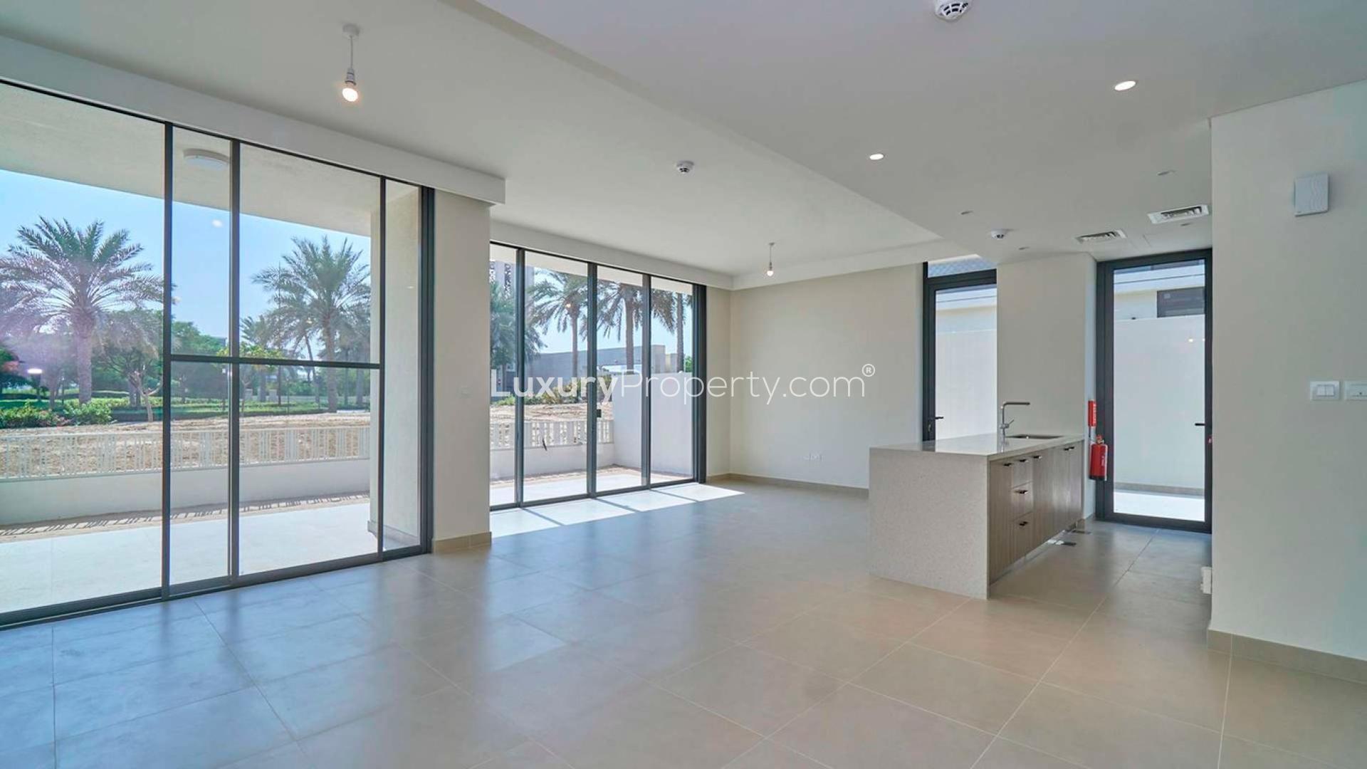 Spacious living area with large windows in Club Villas, Dubai Hills Estate