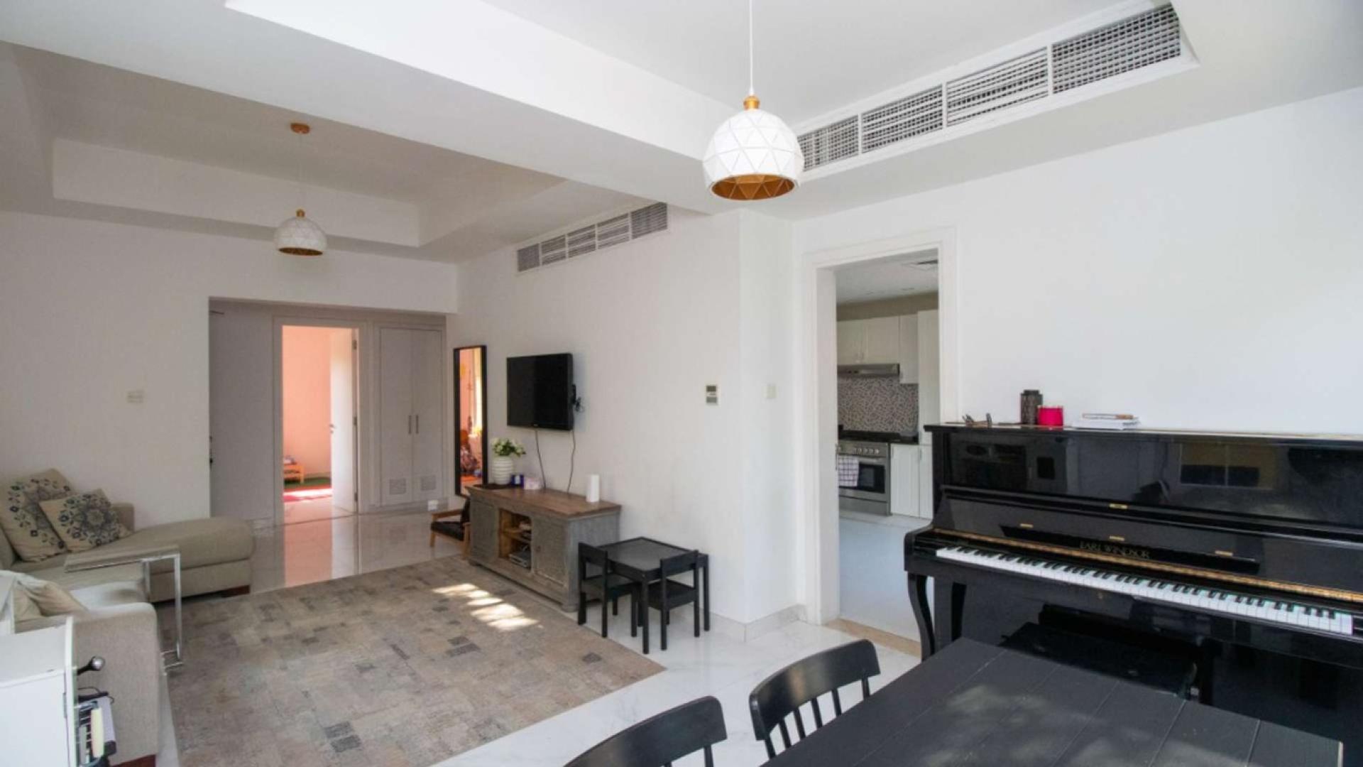 Living room in fully upgraded 3-bedroom villa, The Springs, featuring modern decor and natural light