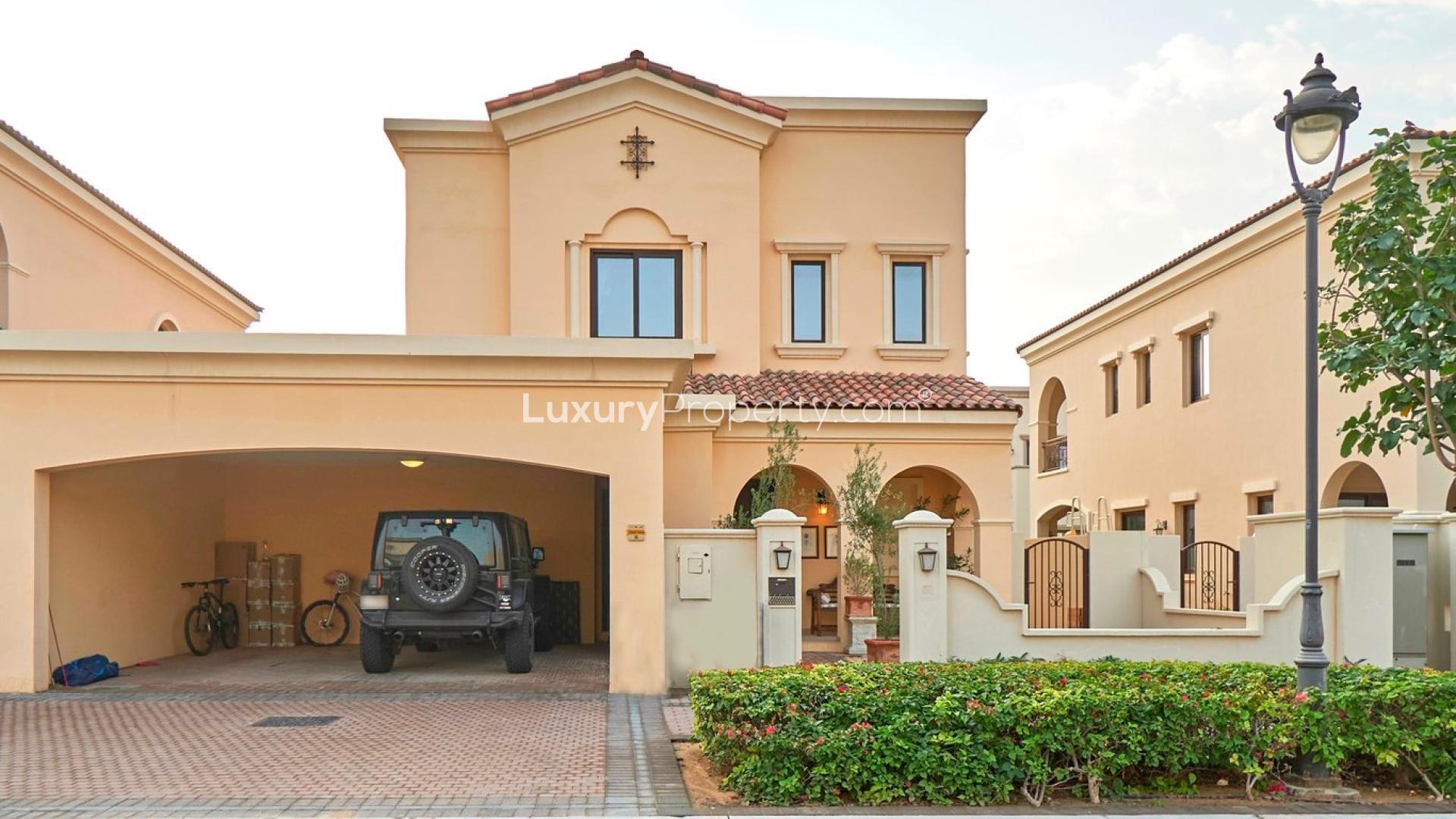 Spanish-style villa exterior with arched entry, garden in Arabian Ranches 2, Lila community