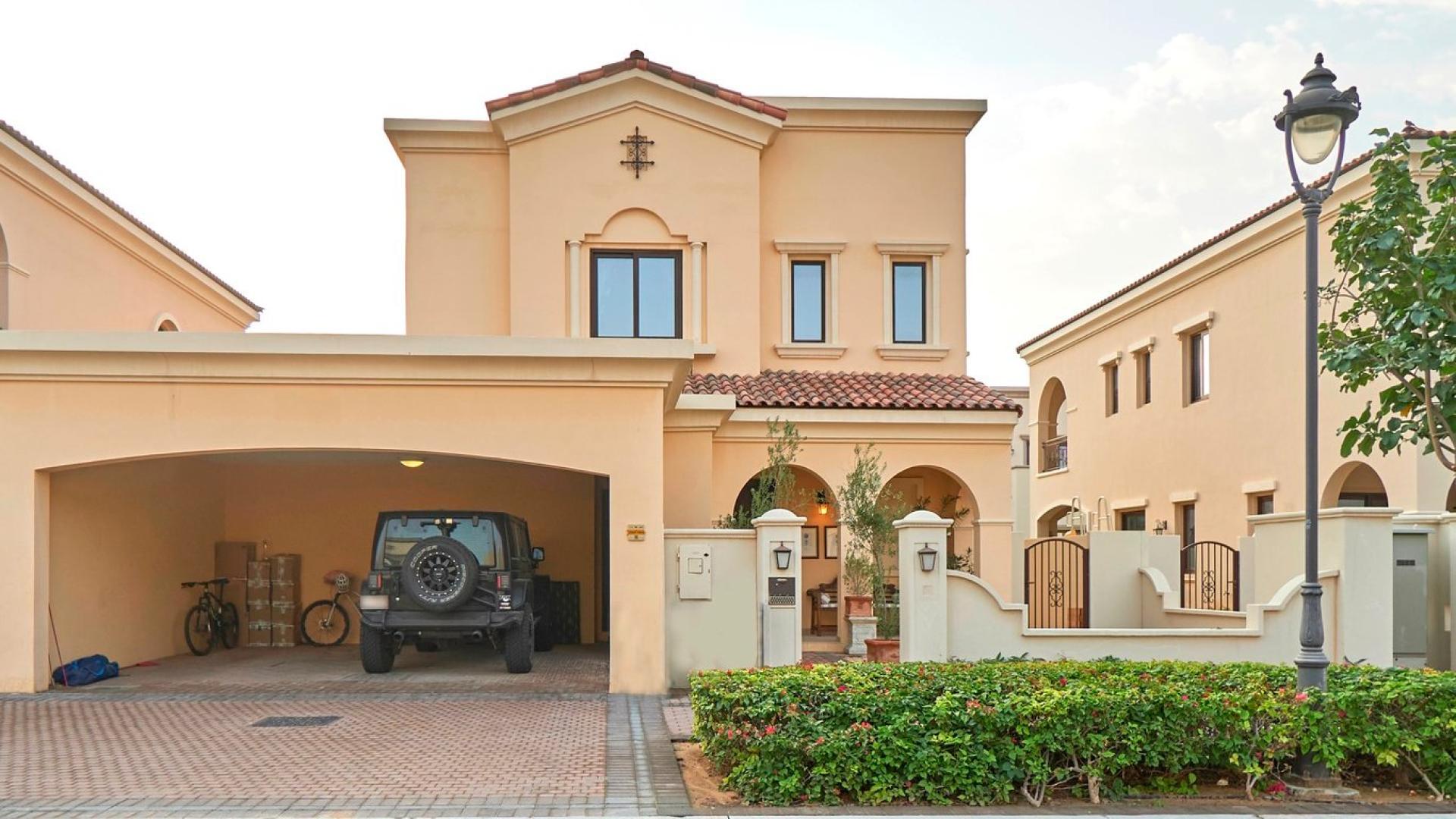 Spanish-style villa exterior with arched entry, garden in Arabian Ranches 2, Lila community