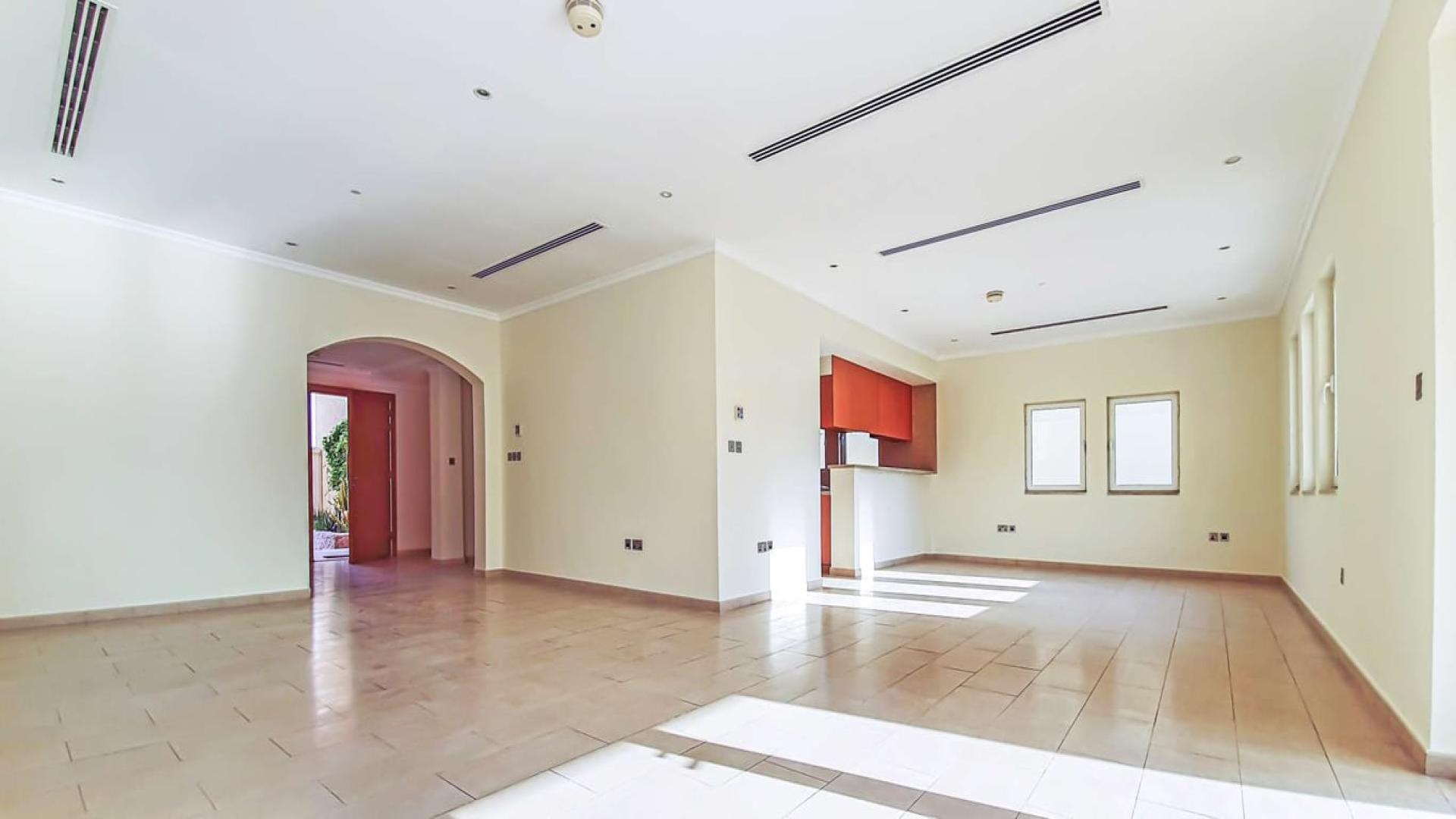 Spacious 3-bedroom villa exterior with garden in Jumeirah Park, Dubai, for rent