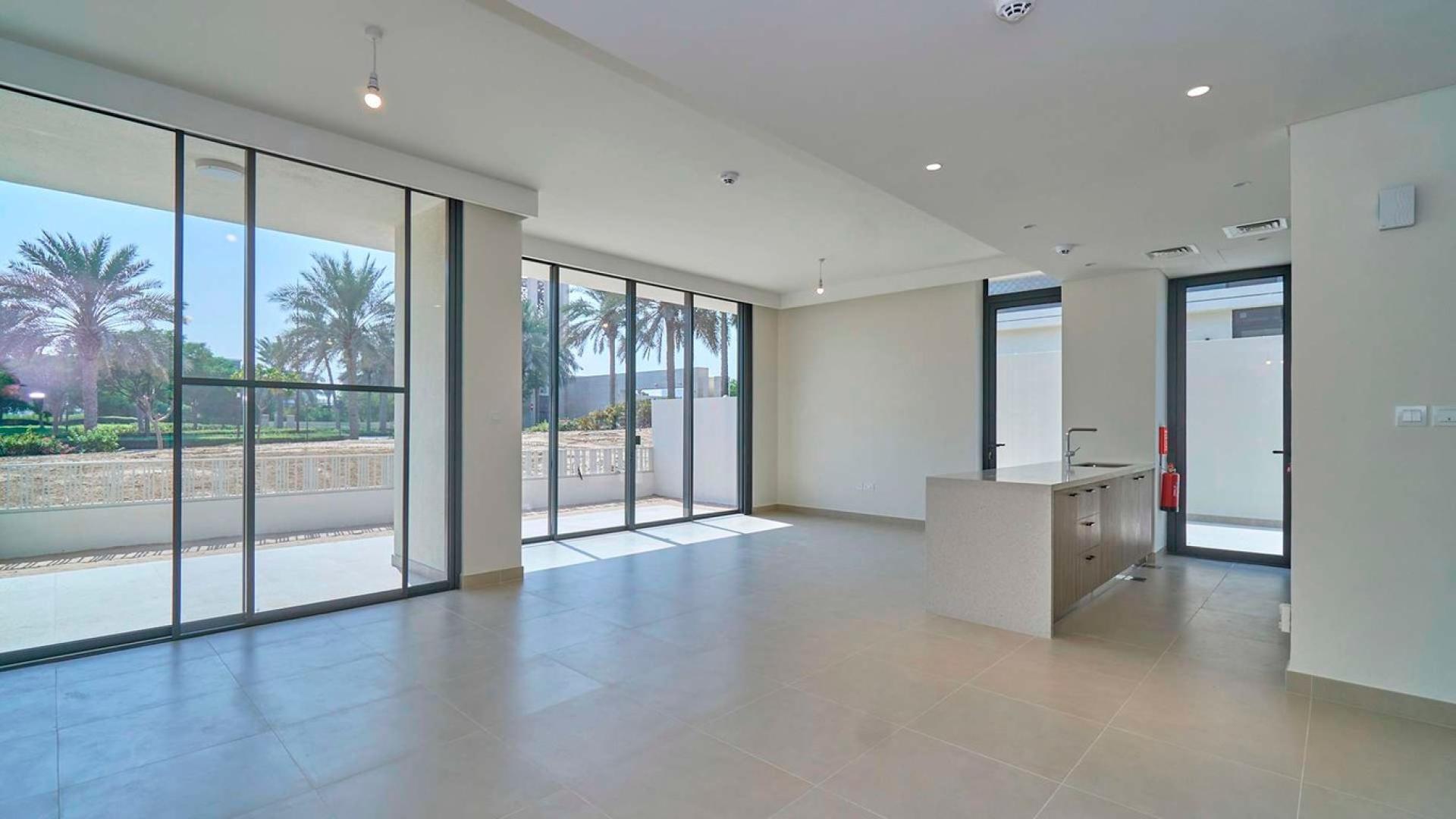 Spacious living area with large windows in Dubai Hills Estate villa for rent