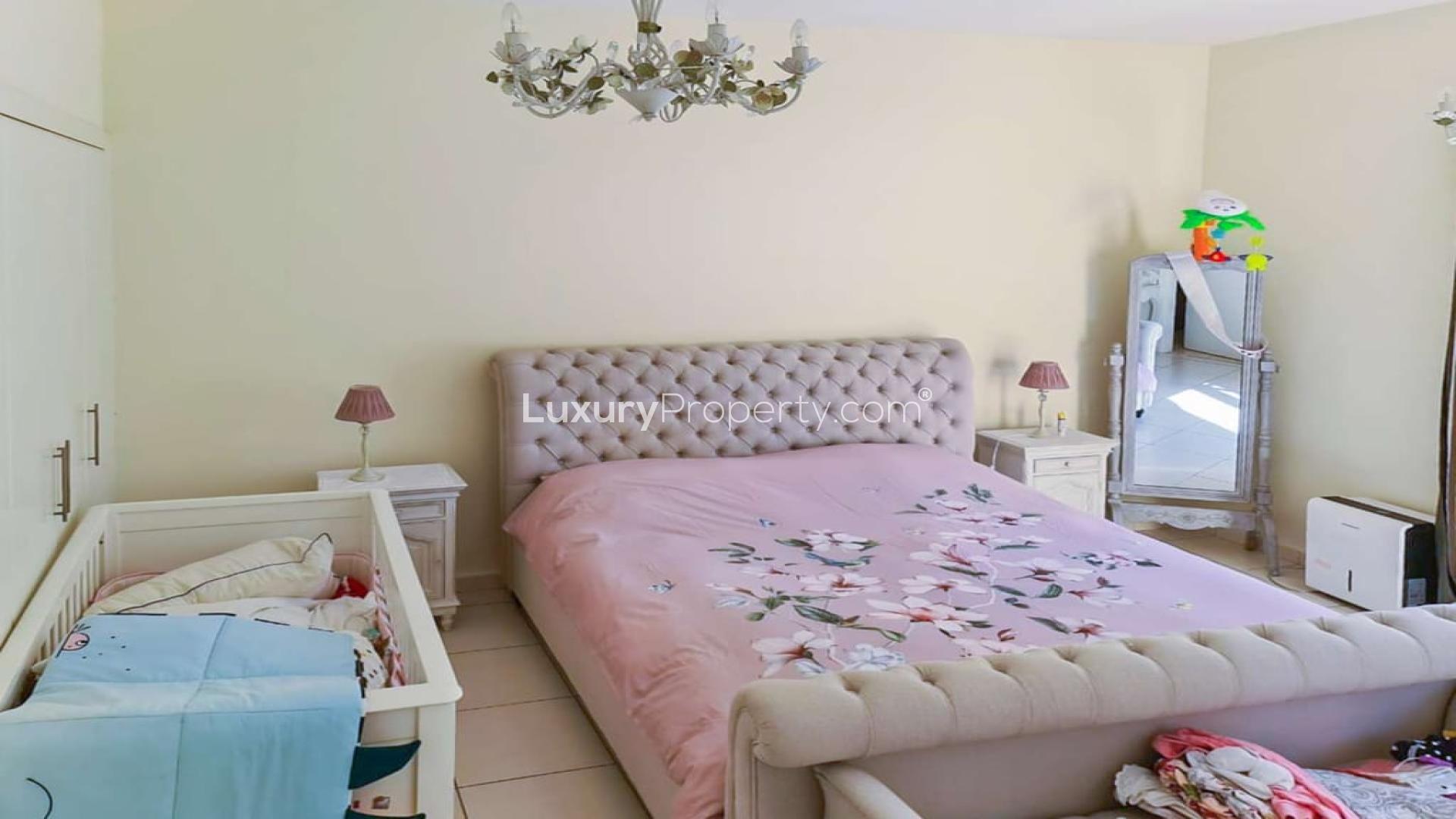 Spacious living room in 7-bedroom villa, Springs 8, Dubai, with modern decor and natural light