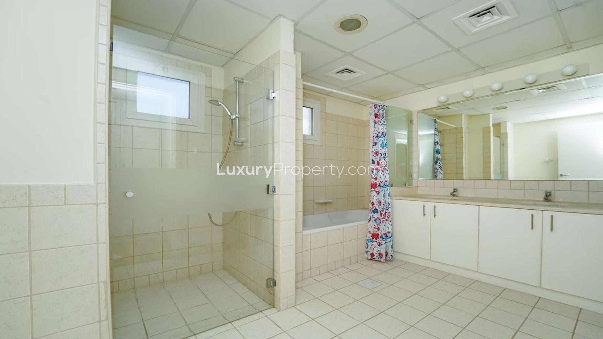 Bright, spacious living area in upgraded Meadows 1 villa for rent, wooden flooring