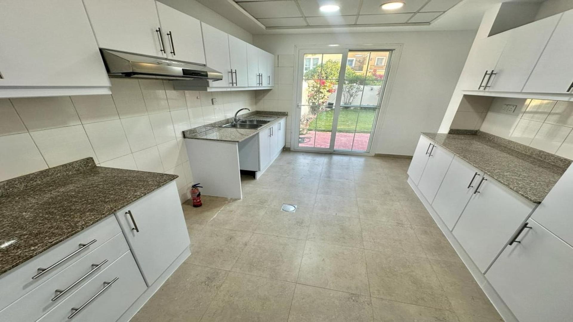 "Spacious garden with gazebo in Al Reem villa, Arabian Ranches, for rent, LP40518.",Upgraded villa kitchen with granite countertops in Al Reem, Arabian Ranches, available for rent