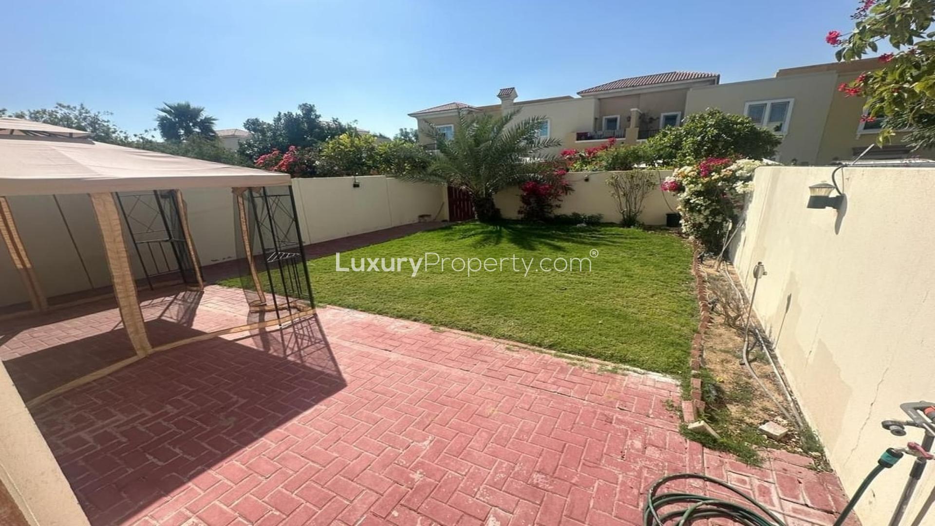 Upgraded 3-bedroom villa exterior with carport in Al Reem, Arabian Ranches, available for rent