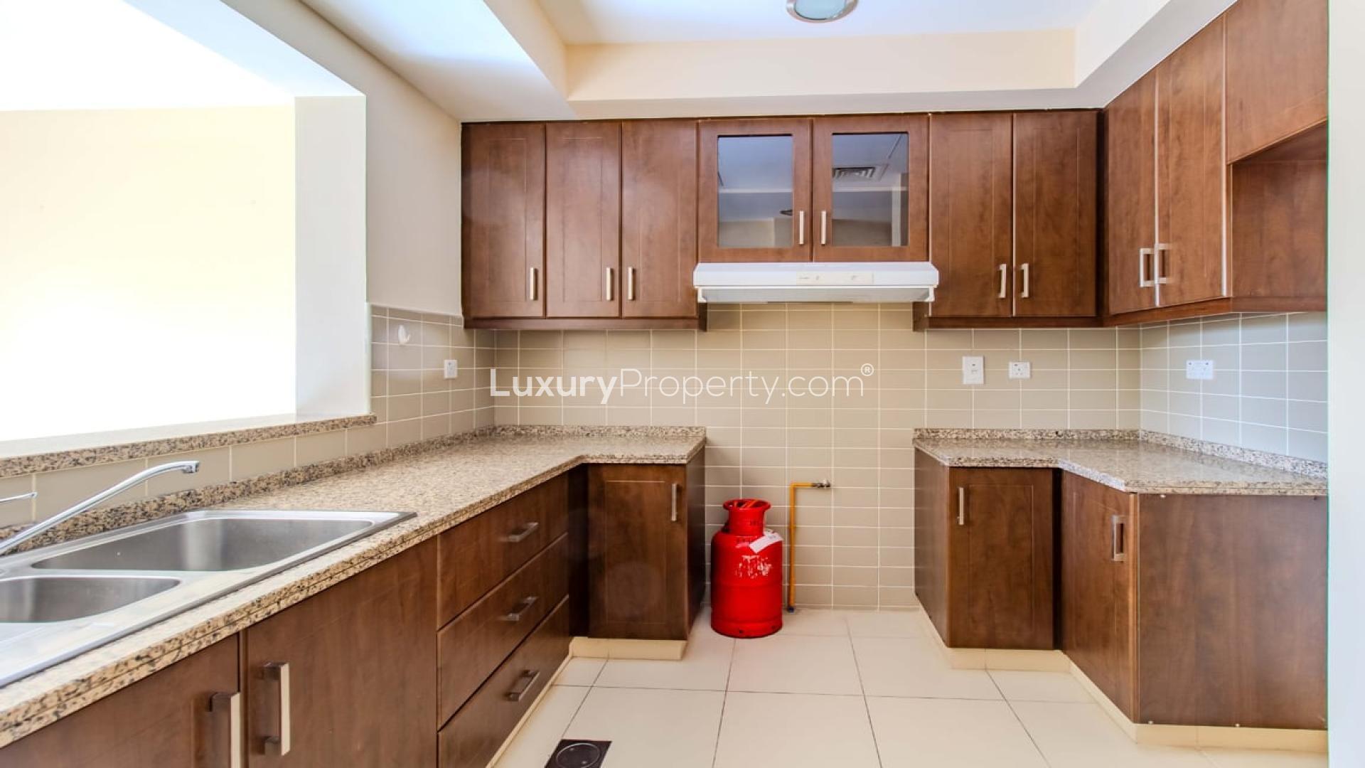 Charming 3-bedroom villa exterior with driveway in Mira, Reem community, available for rent