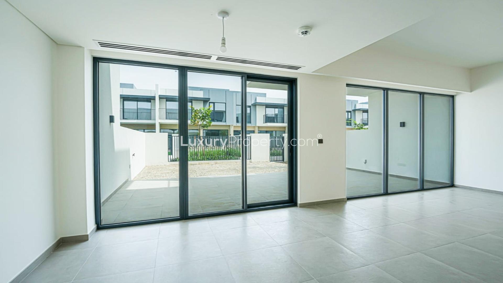 Spacious living area with large windows in Eden villa, The Valley, available for rent