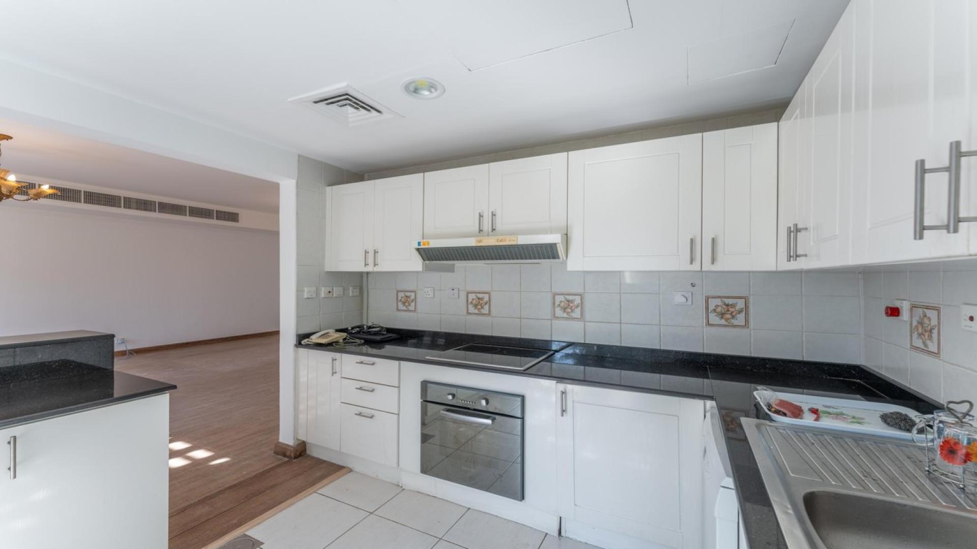 Upgraded kitchen in 3-bedroom villa for rent, Springs 14, with modern appliances and cabinetry