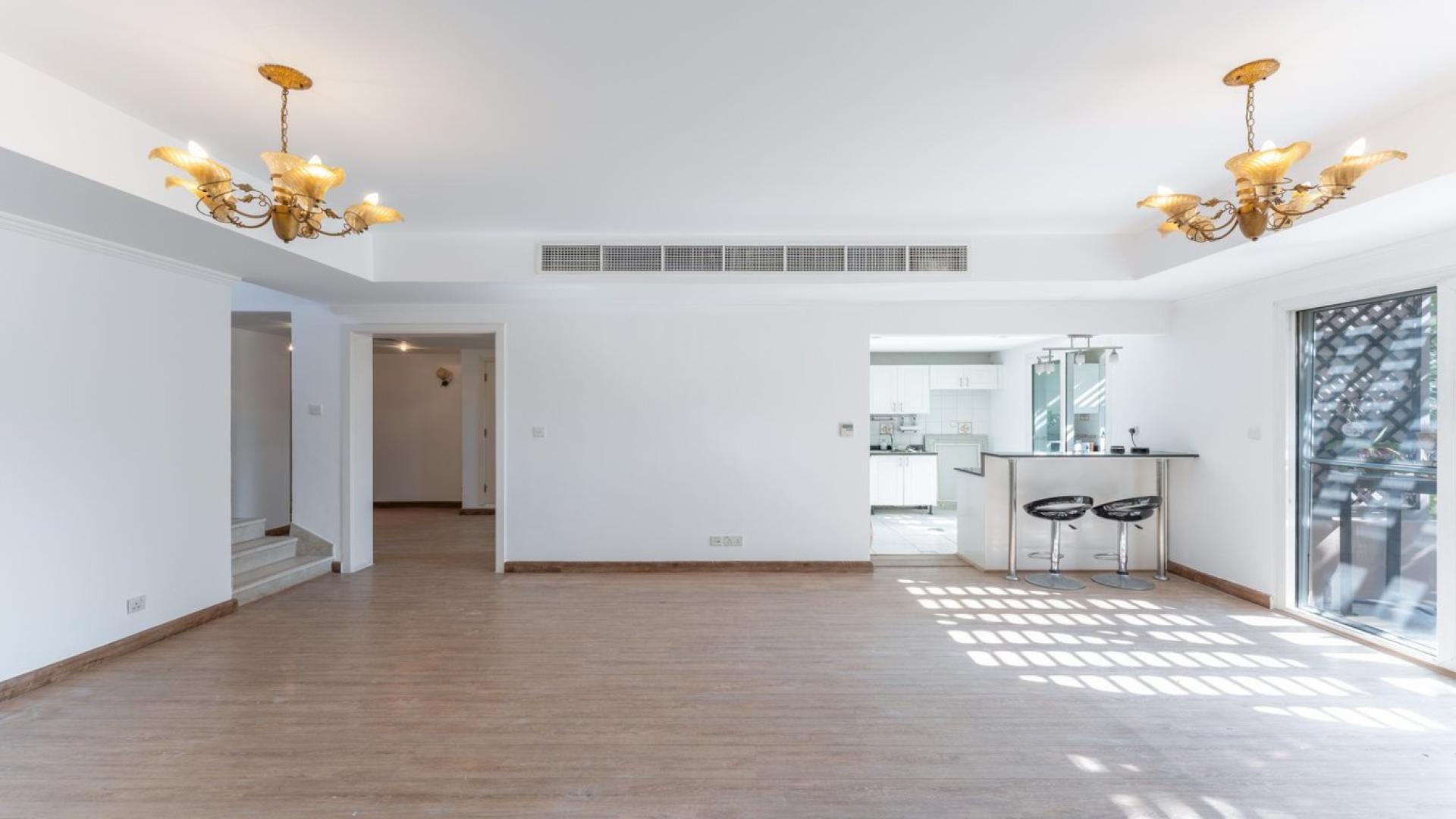 N/A,Bright living area in upgraded 3-bedroom villa, The Springs 14, with modern kitchen