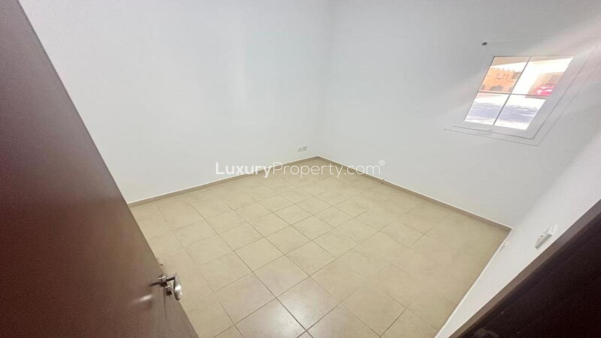 Spacious kitchen in Al Reem villa, Arabian Ranches, available for rent, featuring modern appliances