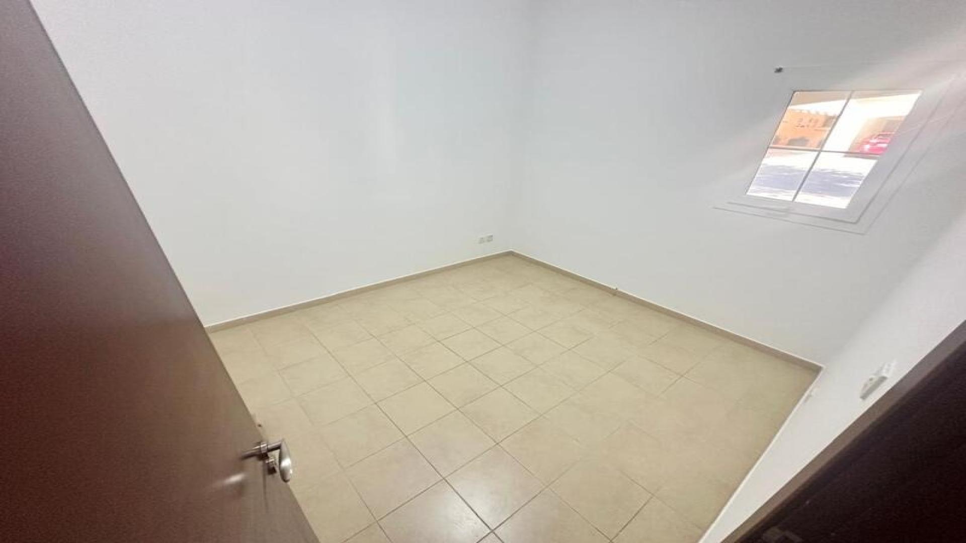 Spacious kitchen in Al Reem villa, Arabian Ranches, available for rent, featuring modern appliances