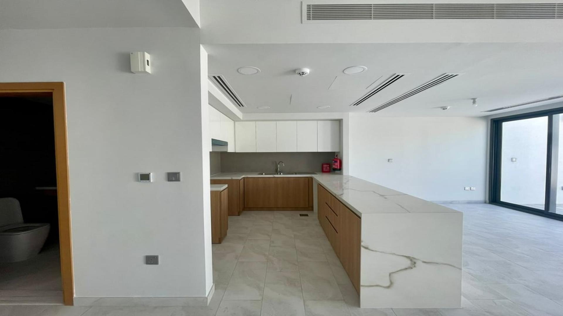 Modern kitchen in brand new villa for rent in Villanova, Dubai Land