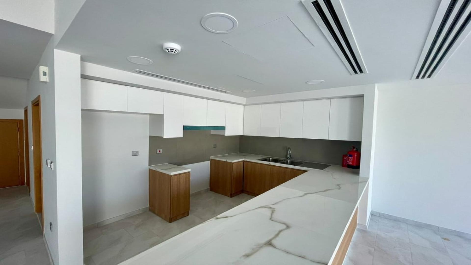 Modern villa interior with open-plan layout and large windows in Villanova, Dubai Land