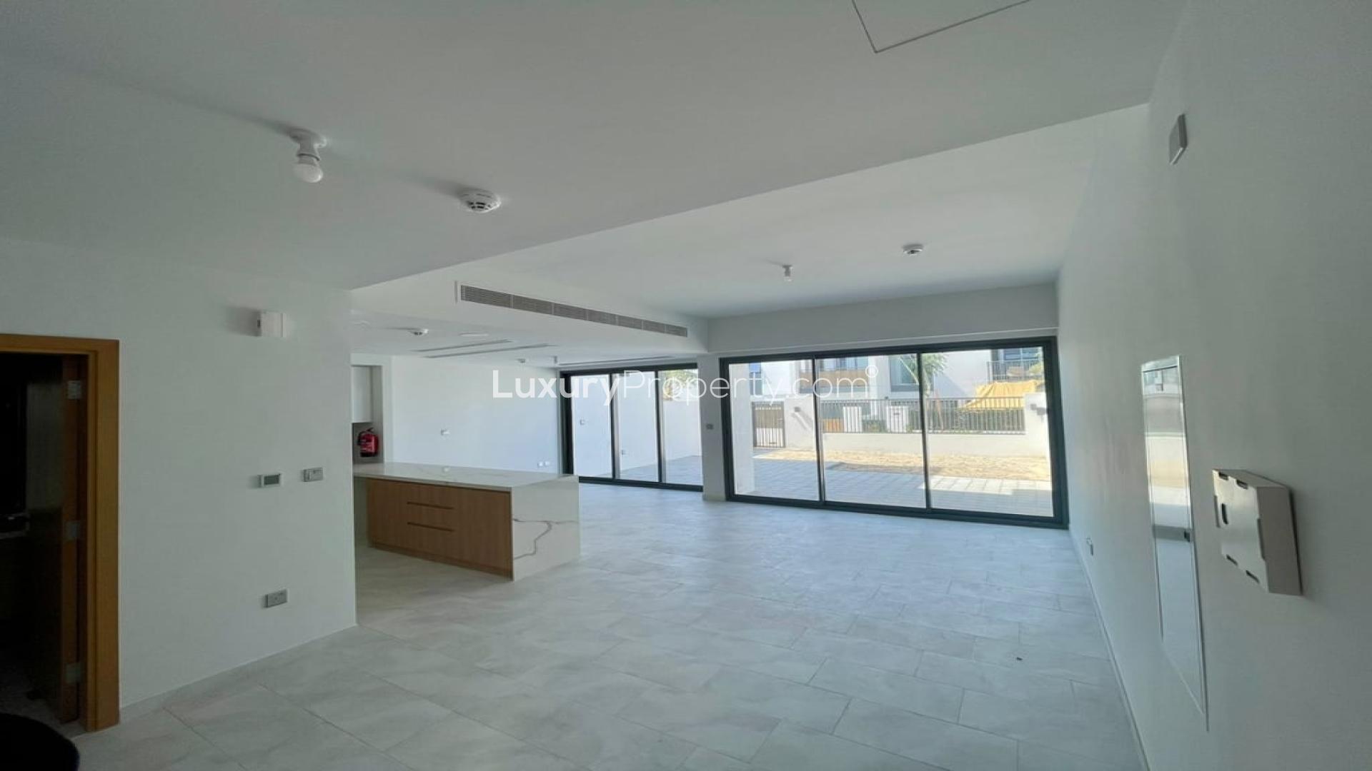 Modern open-plan living area in brand new Villanova villa, Dubai Land